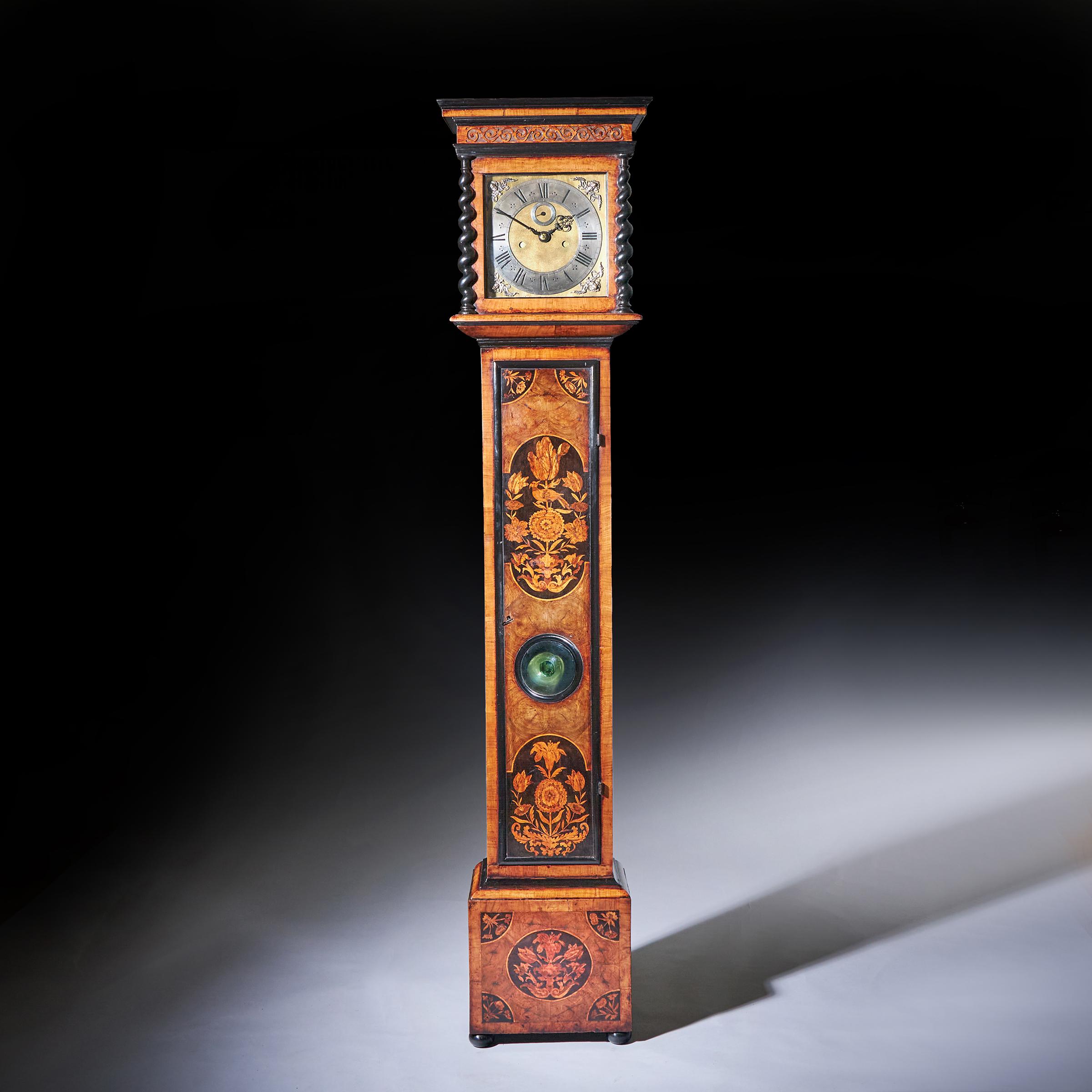 A wonderful late seventeenth century rising hood 10-inch William and Mary eight-day floral marquetry olive oyster longcase clock by Edmund Appley, London, c. 1680-1685.

The attractive and fine olive oyster-veneered case is of the highest quality