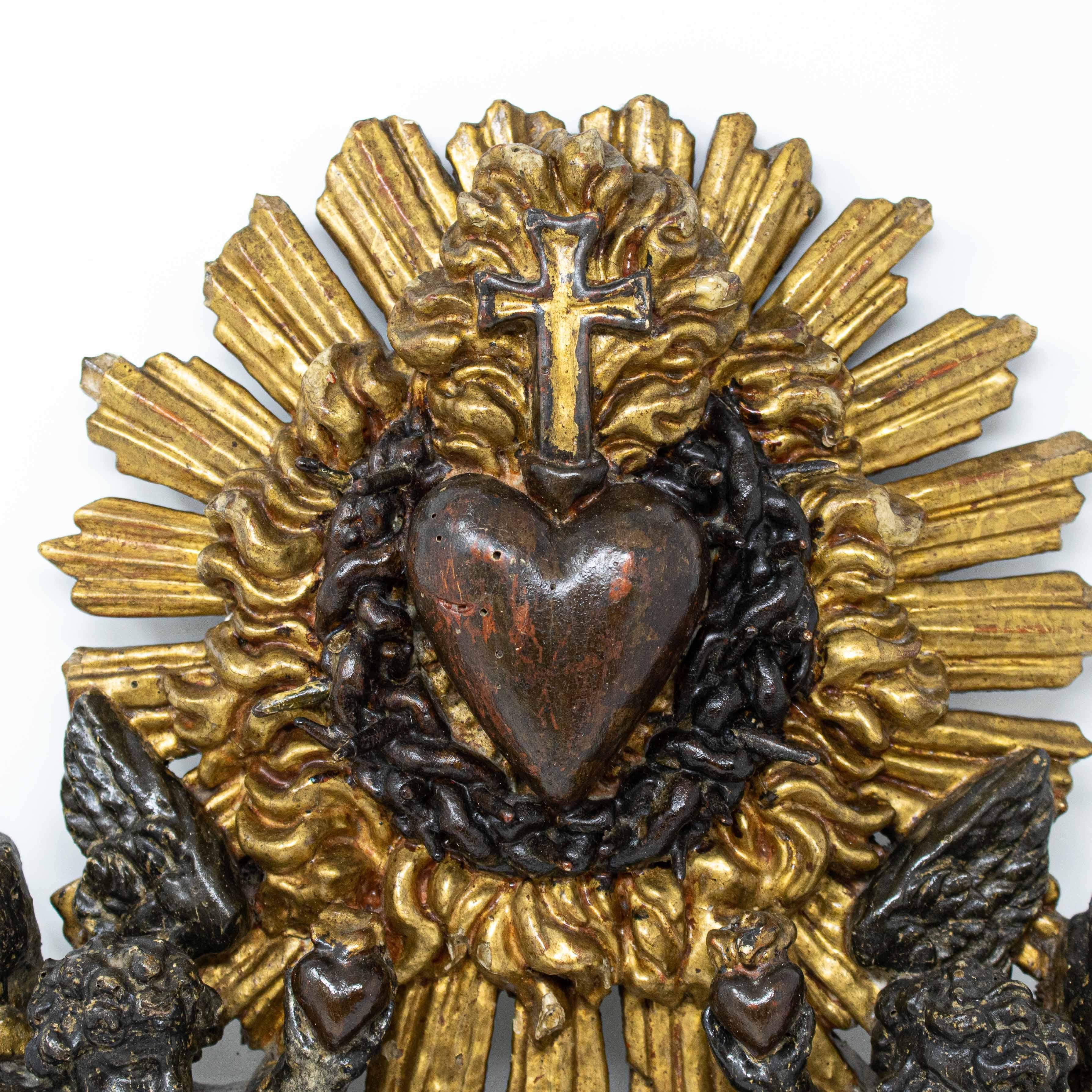 17th century
Adoration of the Sacred Heart of Jesus
Carved, ebonized and gilded wood, 40 x 31 cm

The first mention of the Heart of Jesus occurs in the Gospel according to Matthew (11: 28-29): 