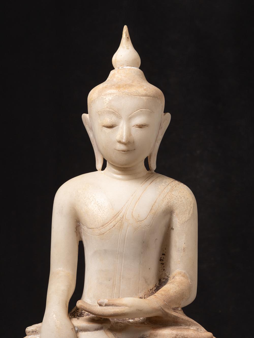 This antique marble Burmese Buddha statue is a magnificent With traces of the original lacquer and 24 krt. gilding. Crafted from marble, it stands at an impressive height of 73 cm and has dimensions of 43 cm in width and 24.5 cm in depth. 

The