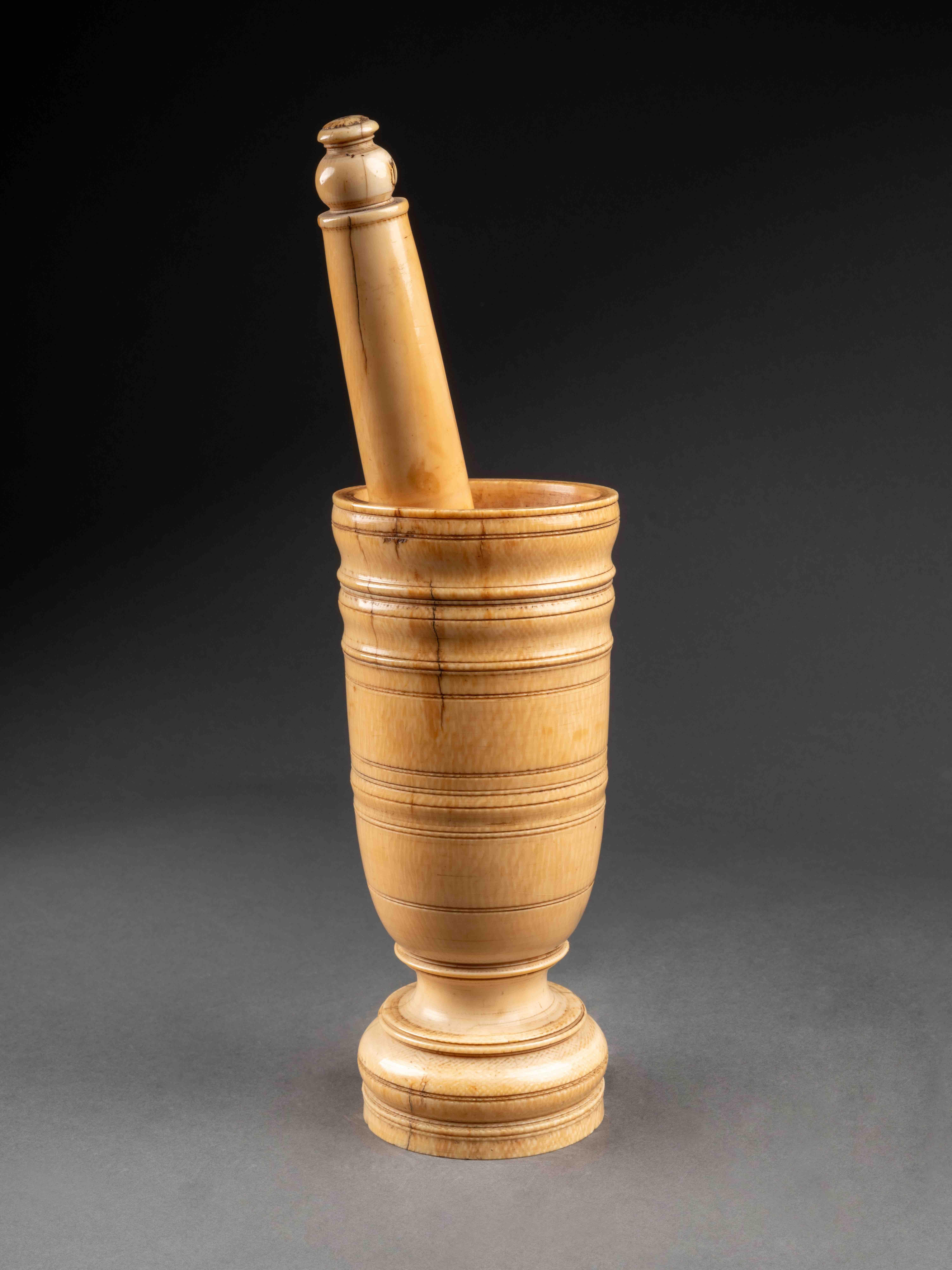 large 17th century turned apothecary's ivory mortar and pestle

Germany
17th century
Cites certificate number IT/CE/2023/MI/01110
18,6 x 7 cm ; pestle 21,5 cm

Beautiful conditions and patina. 