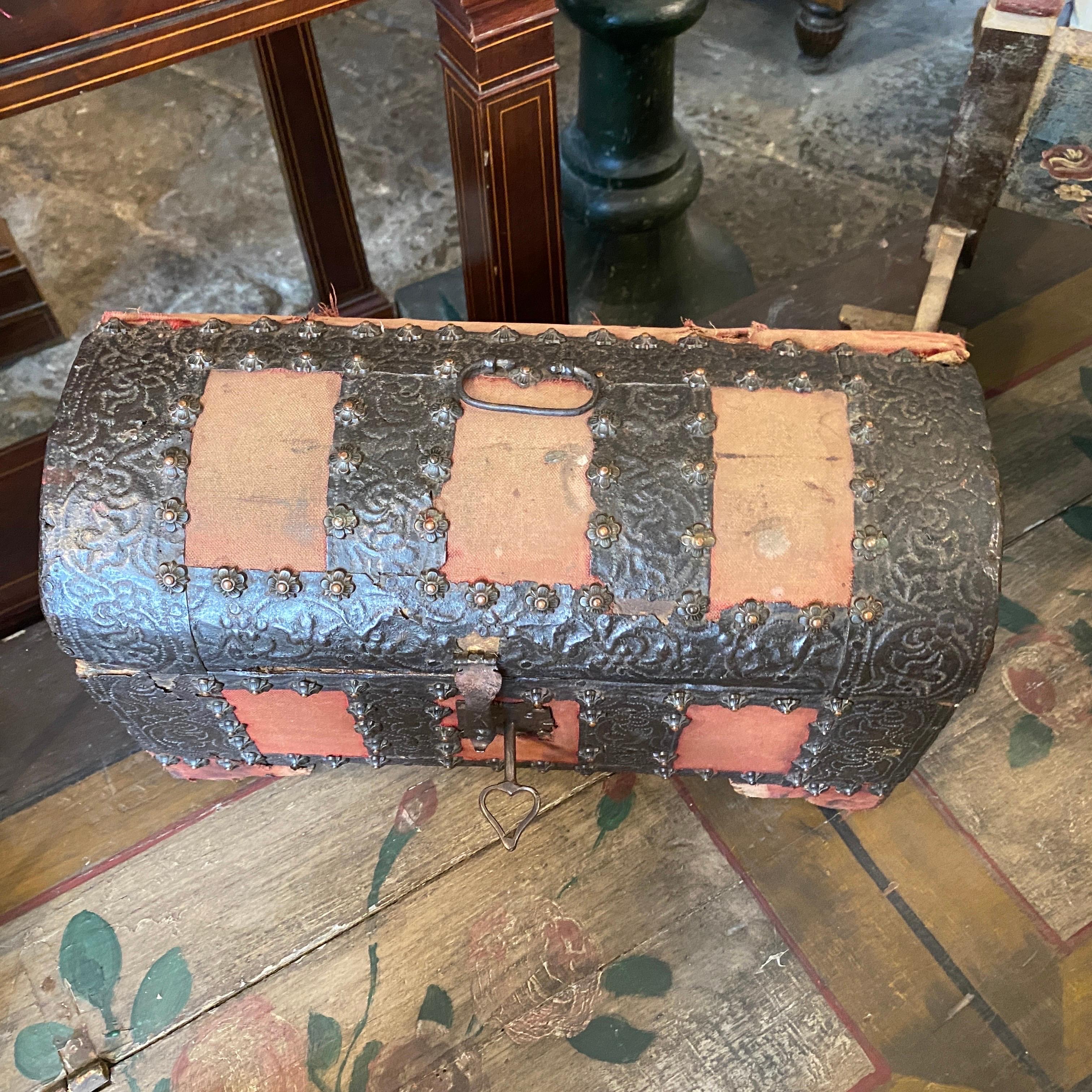 A small trunk hand-crafted in Sicily in the 17th century, it's in original antique conditions ad you can see in the pictures, wood, iron and fabric have been never restored.