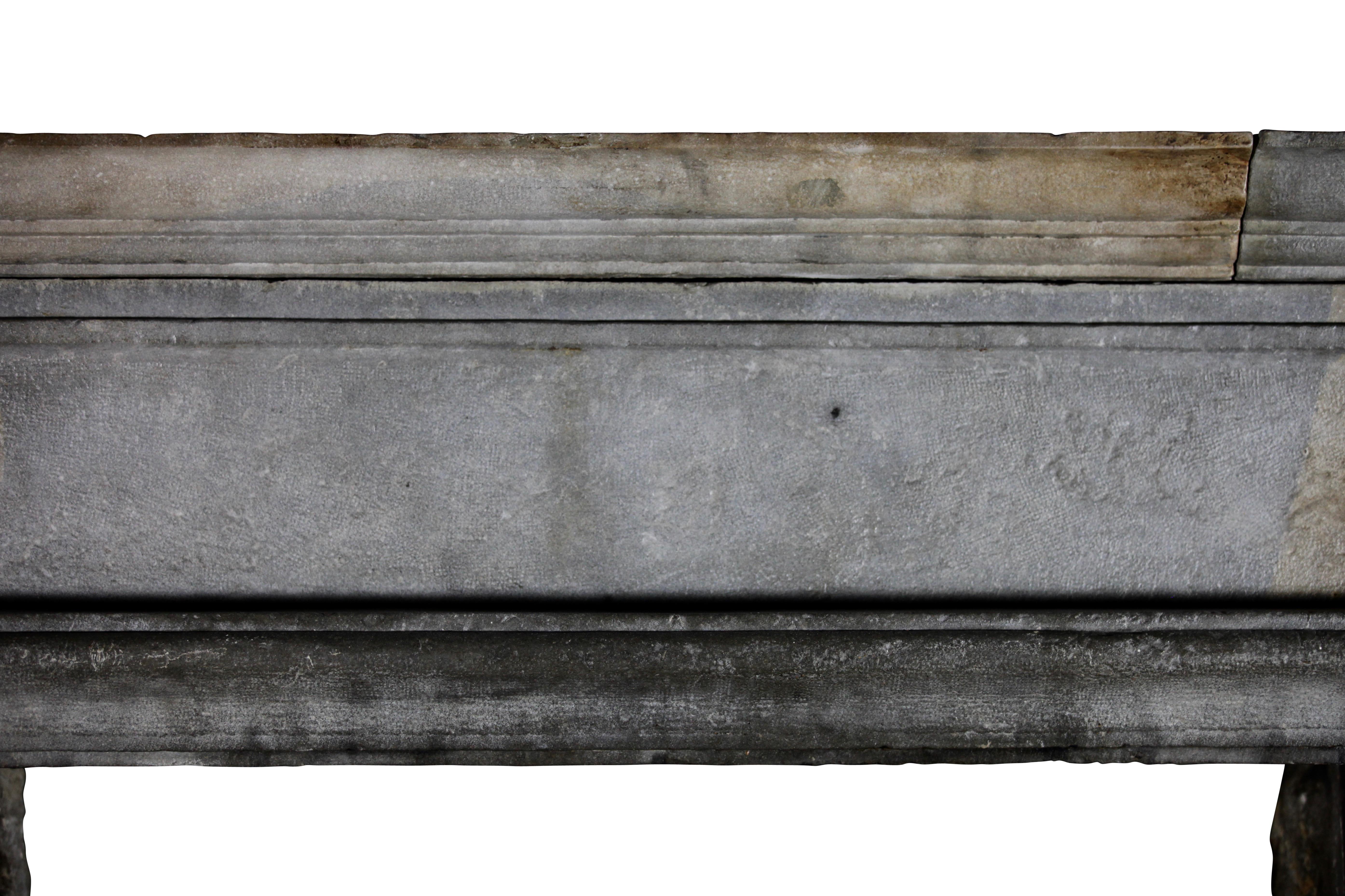 One word. Phenomenal. This original bicolor hard stone fireplace surround is a very early 17th century from the Louis XIII period.
The patina, size, color, condition and patina makes it a very special piece. It fits for European Country interior