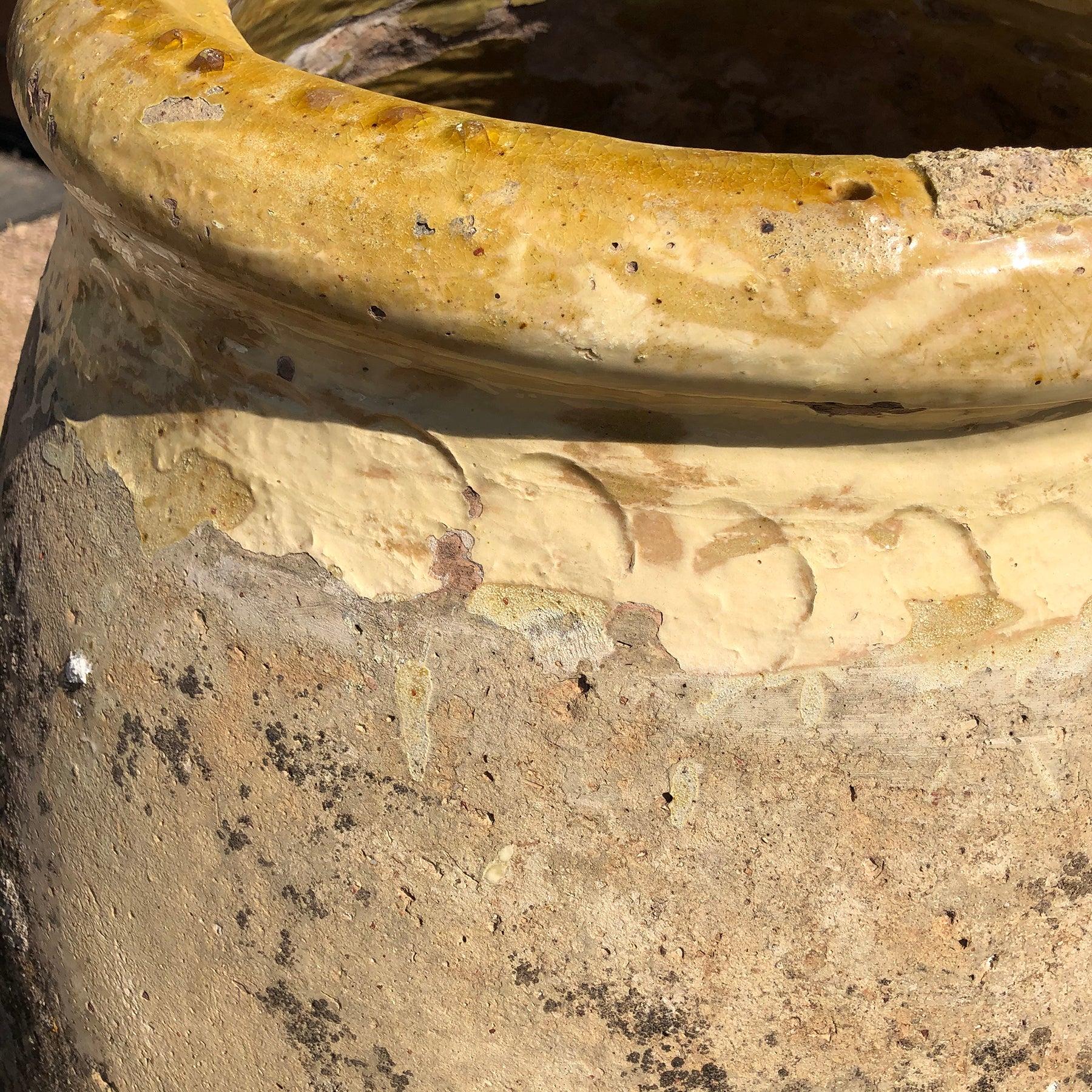 17th Century with fifteen (15) Stamps
This Biot Jar has a wide ochre glaze around the lip with a speckled body.

Classic French Antique Biot Olive Oil Jars date back to the 16th century. 
Biot potters worked from generation to generation, and