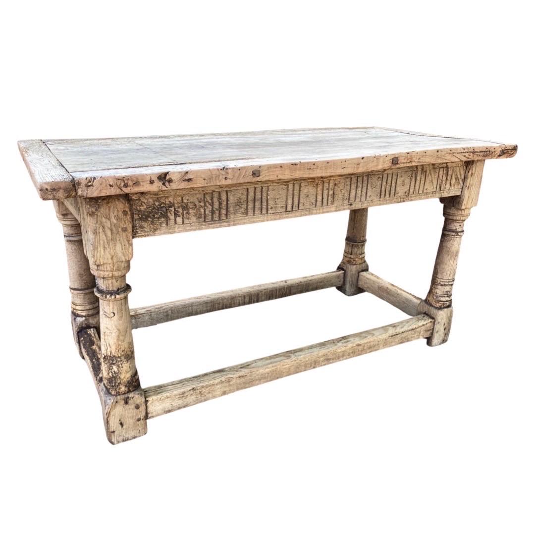 Kitchen or Farm Table hand-made in England in the mid 1600s using oak and pegged construction. This is an absolutely stunning table with a long, long life. Being an antique dealer I come across a lot of pieces that are very old but there are some