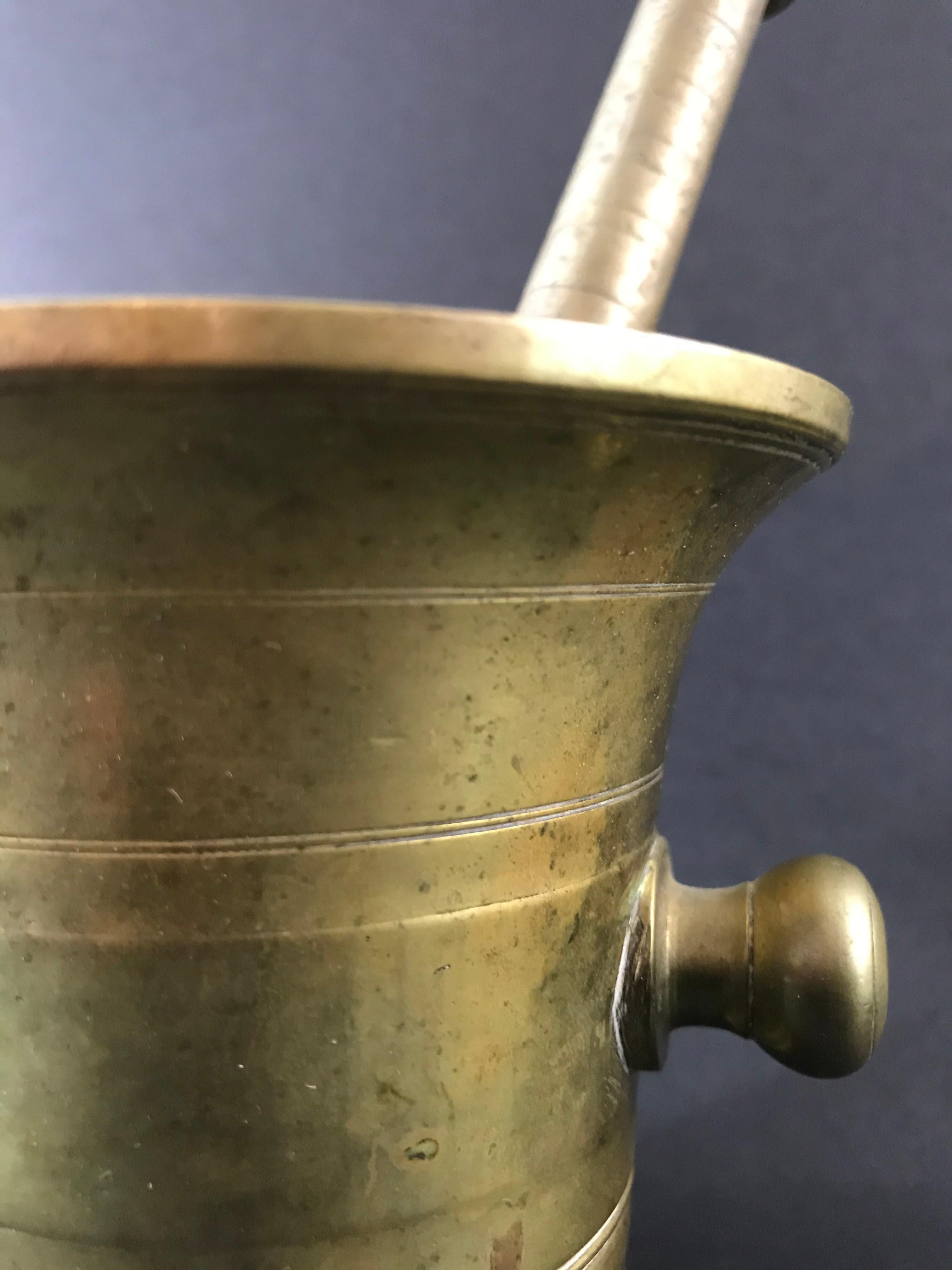 Bronze mortar and pestle.
17th or 18th century
Measures: Mortar height: 4 inches
Pestle height: 7.5 inches.