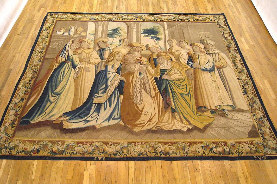 Tapiz mitológico de Bruselas de la primera mitad del siglo XVII, tejido por Peter van den Berghen, que representa una escena interior de la historia de la guerra de Troya. En el centro, Menelao recibe una copa de una mujer que sostiene un cetro,