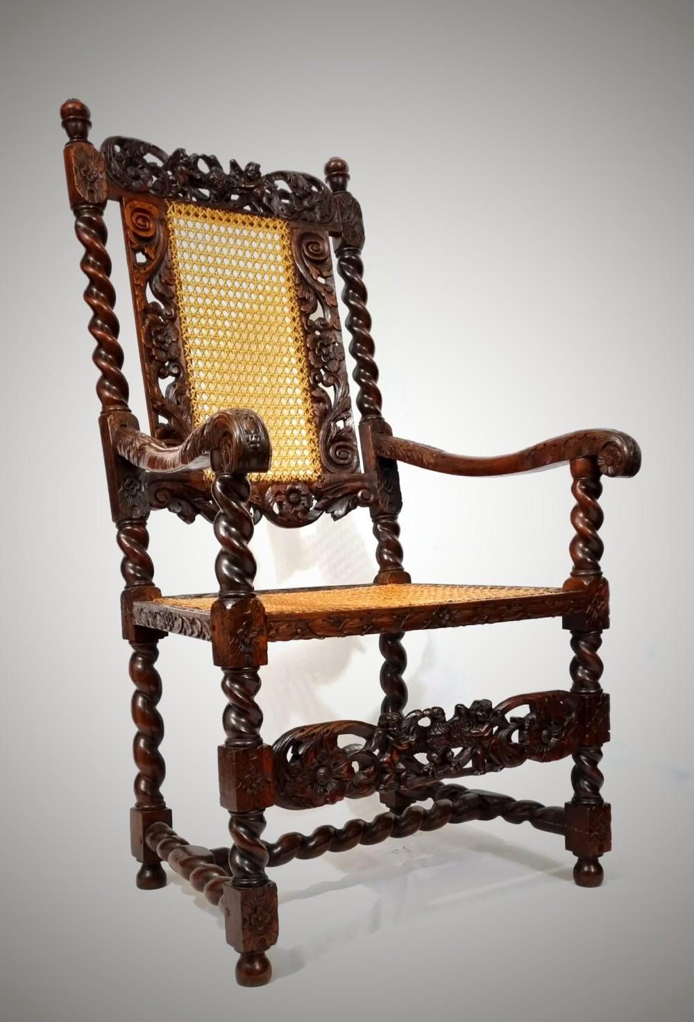 An Original English 17th century walnut armchair dating from the 1660s .Exquisitely carved with cherubs / eagles/ foliage .This chair is of exceptional quality and colour , the detail in the carving is breathtaking ! An amazing survivor being