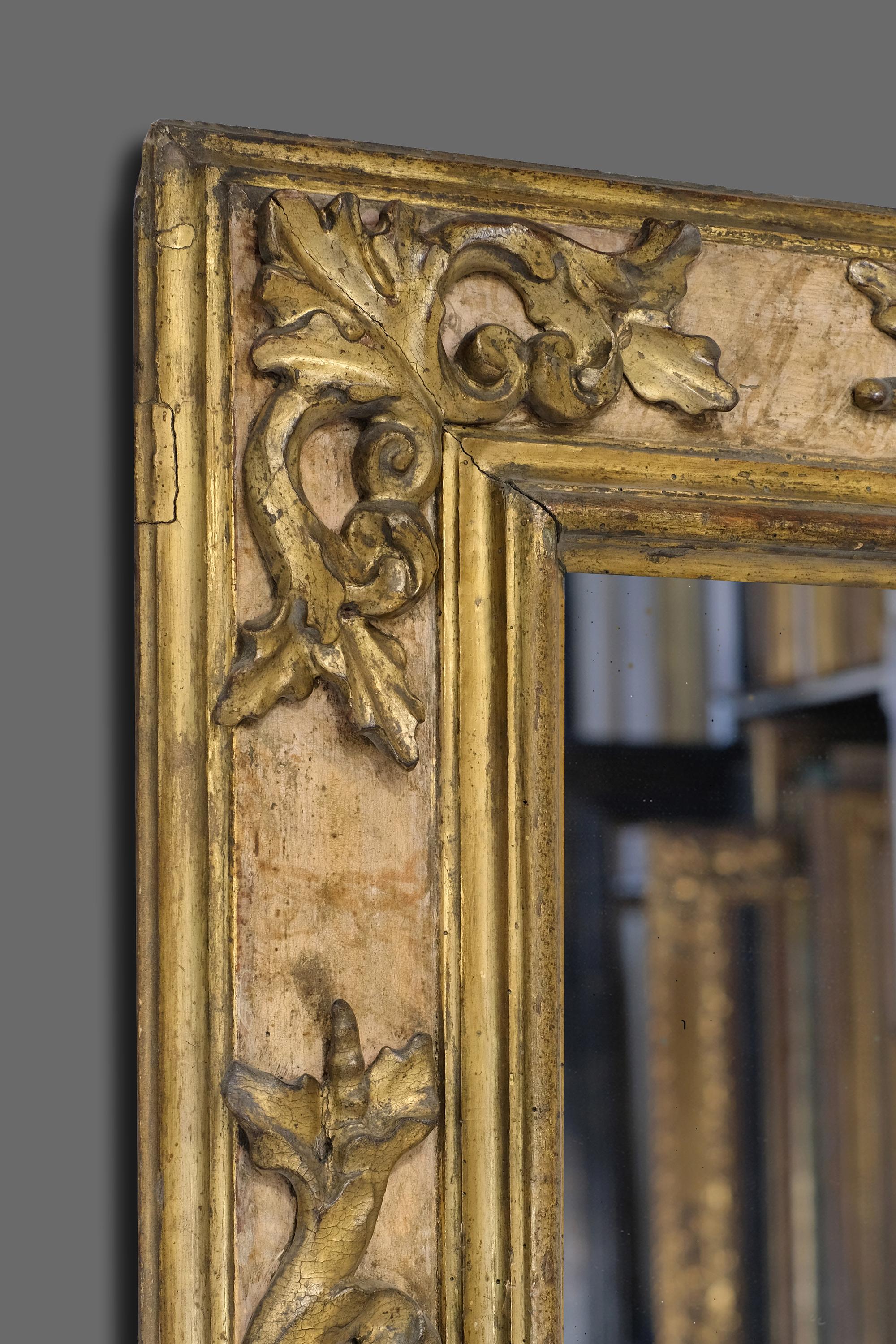 This is a beautifully hand carved, 17th century Italian (Tuscan) Baroque cassetta frame. It has a bolection - architrave profile with carved applied corner-&-center openwork foliate C-scrolled cartouches. The frame retains it's original matte and