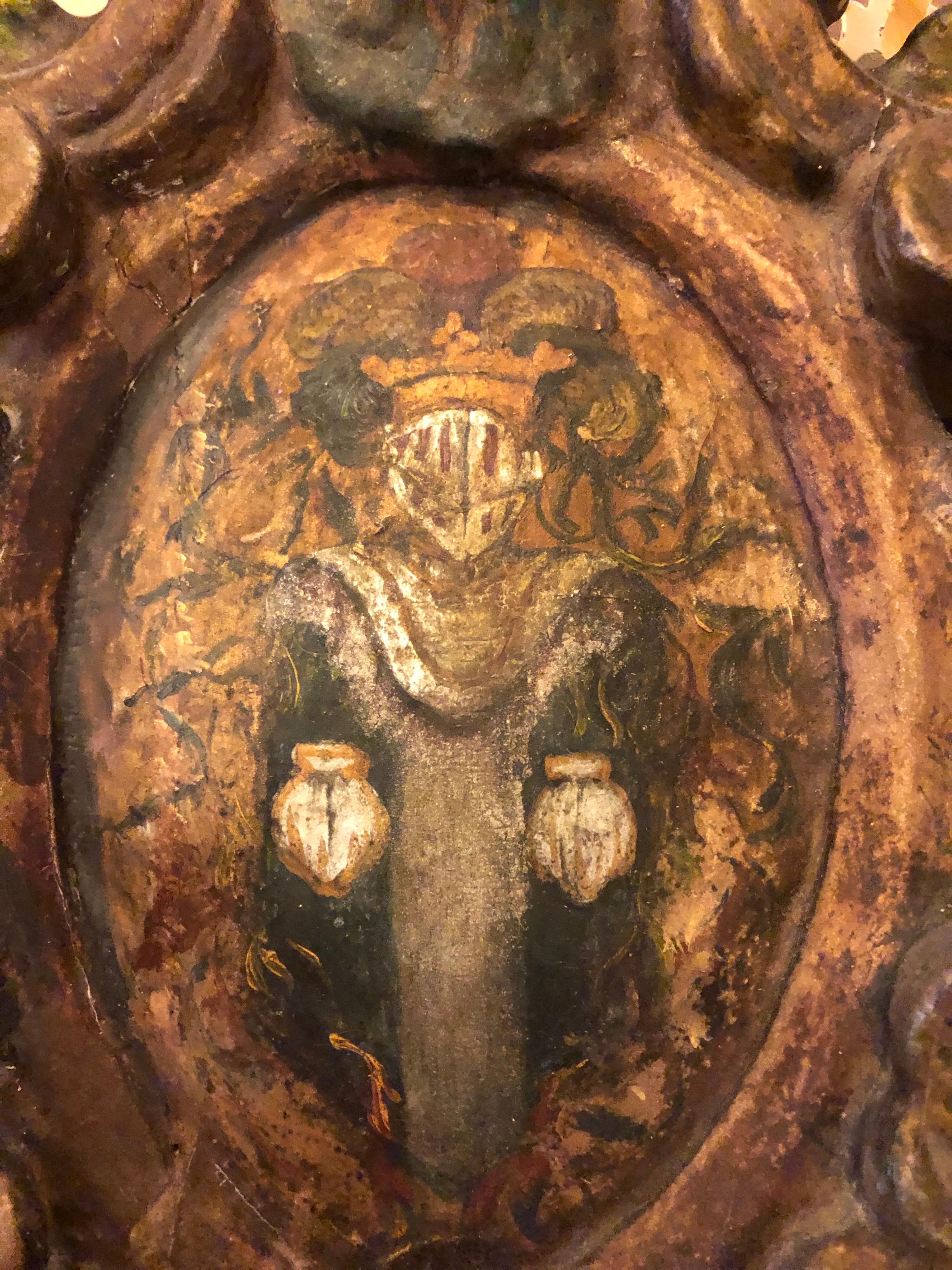 Small polychromed 17th century amorial crest fragment. 
 