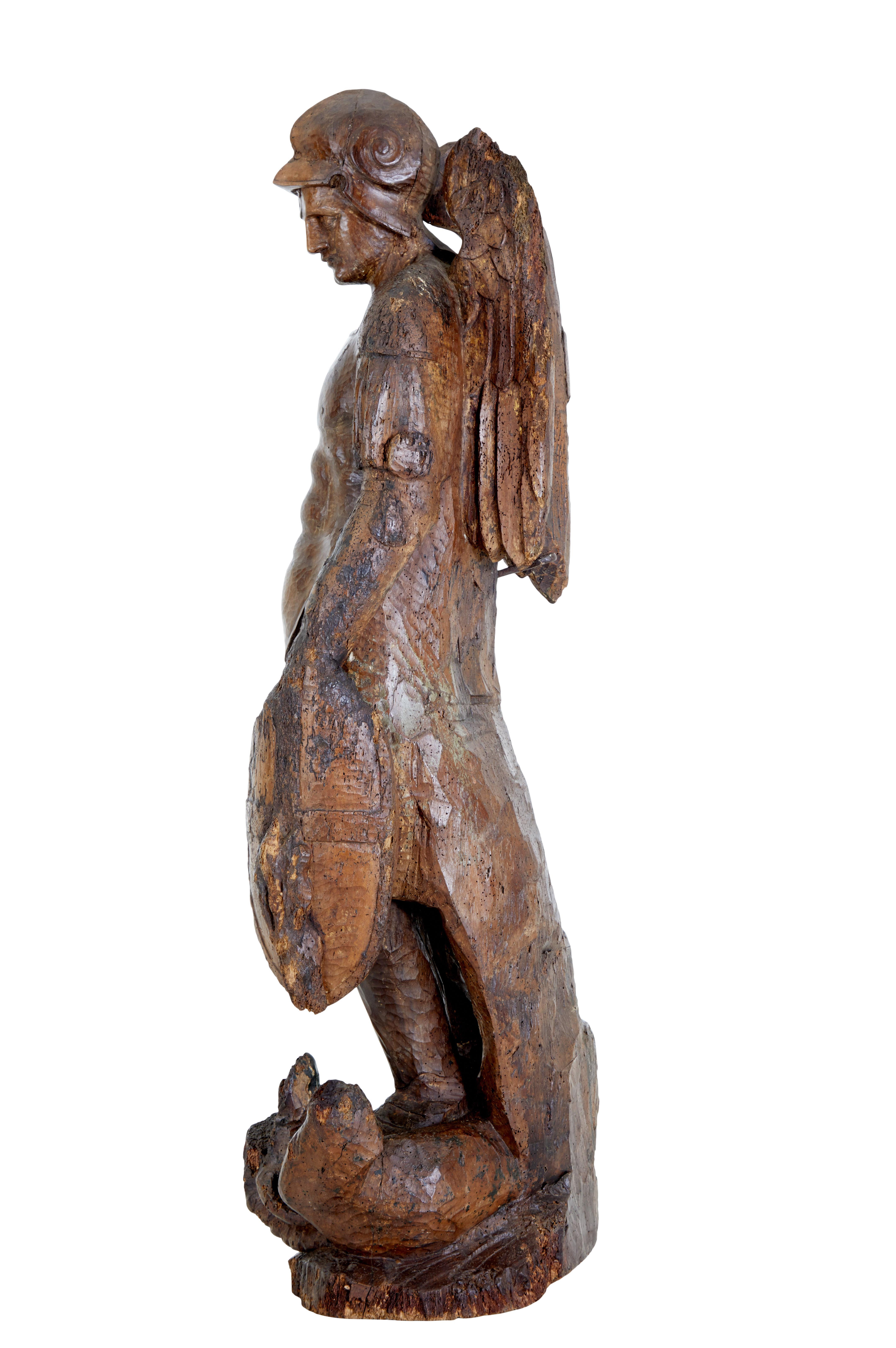 Early 17th century carved limewood figure of st michael circa 1640.

Beautiful floor standing figure of the st michael the dragon slayer, also known as archangel michael.  Michael has many forms and beliefs in most religion.  We believe our piece to