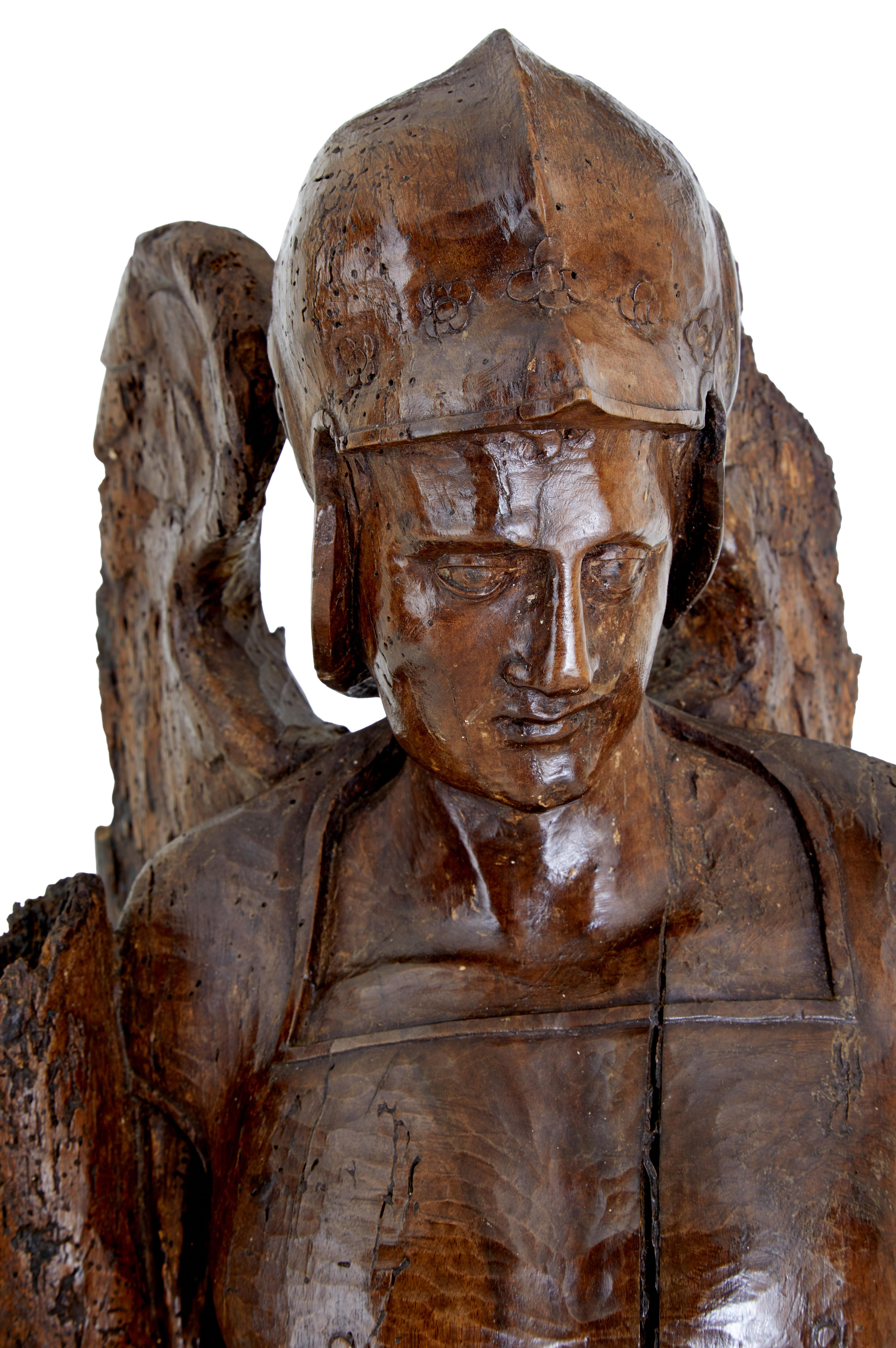 Oak 17th century carved limewood figure of St Michael For Sale