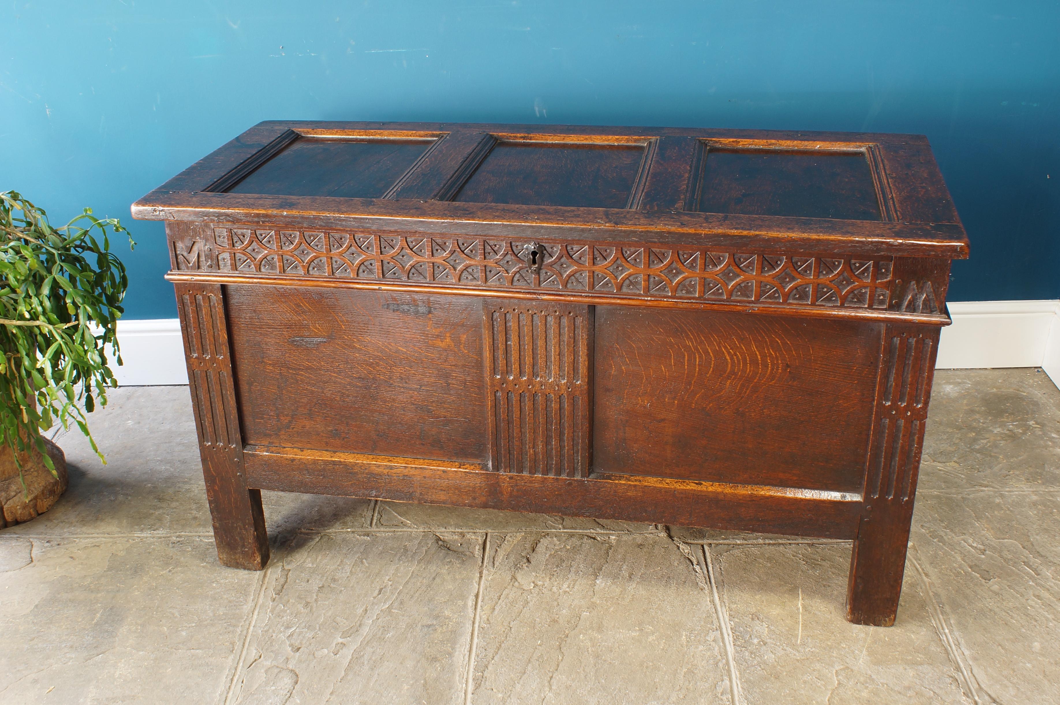 A good clean and original 17th Century Oak Coffer. With a crisply carved strapwork top rail. The legs and wide centre rail are carved with a fluted design.
Excellent colour and condition, standing well up on its legs and retaining the original