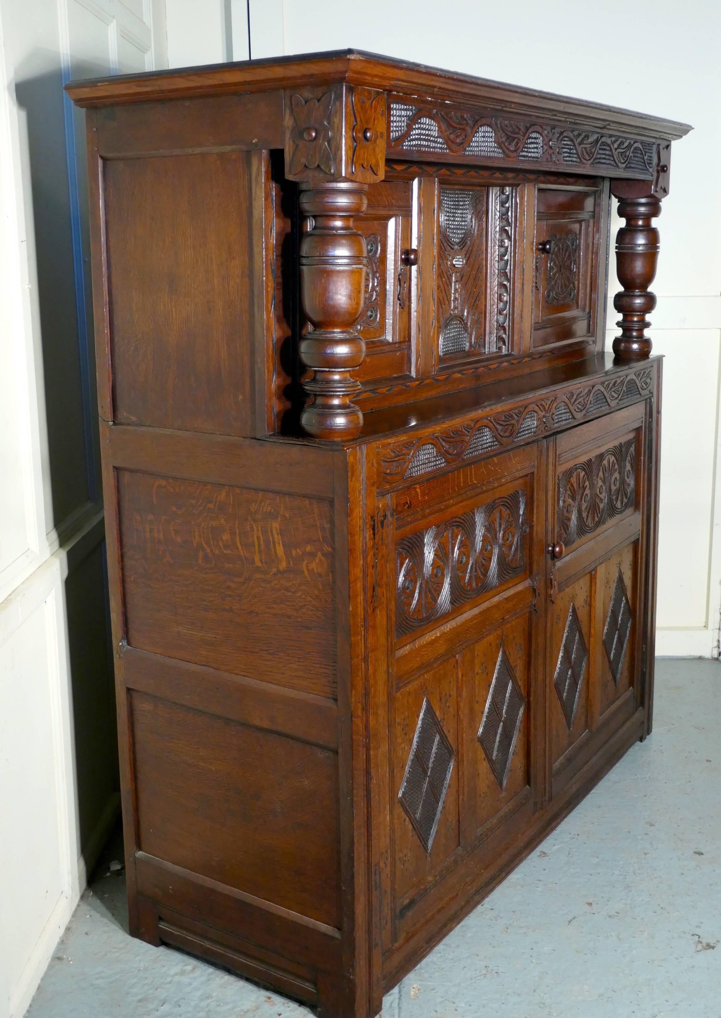 17th century carved oak court cupboard, 

This old and roomy cupboard is made in solid oak and needless to say it is very heavy, luckily it does come into two pieces for transportation
This is an old and charming rustic piece of carved oak