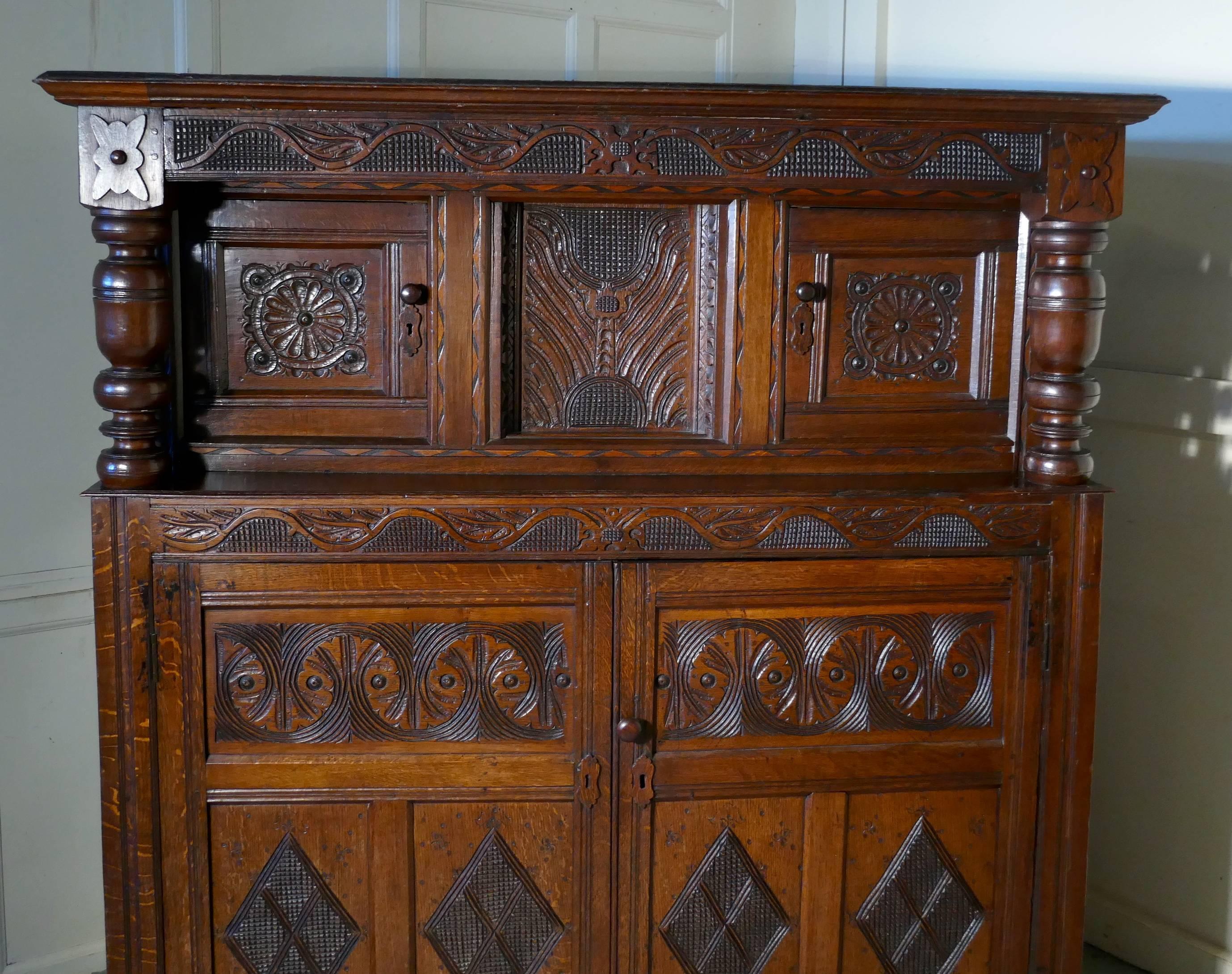 18th Century and Earlier 17th Century Carved Oak Court Cupboard, Primitive Celtic Carving