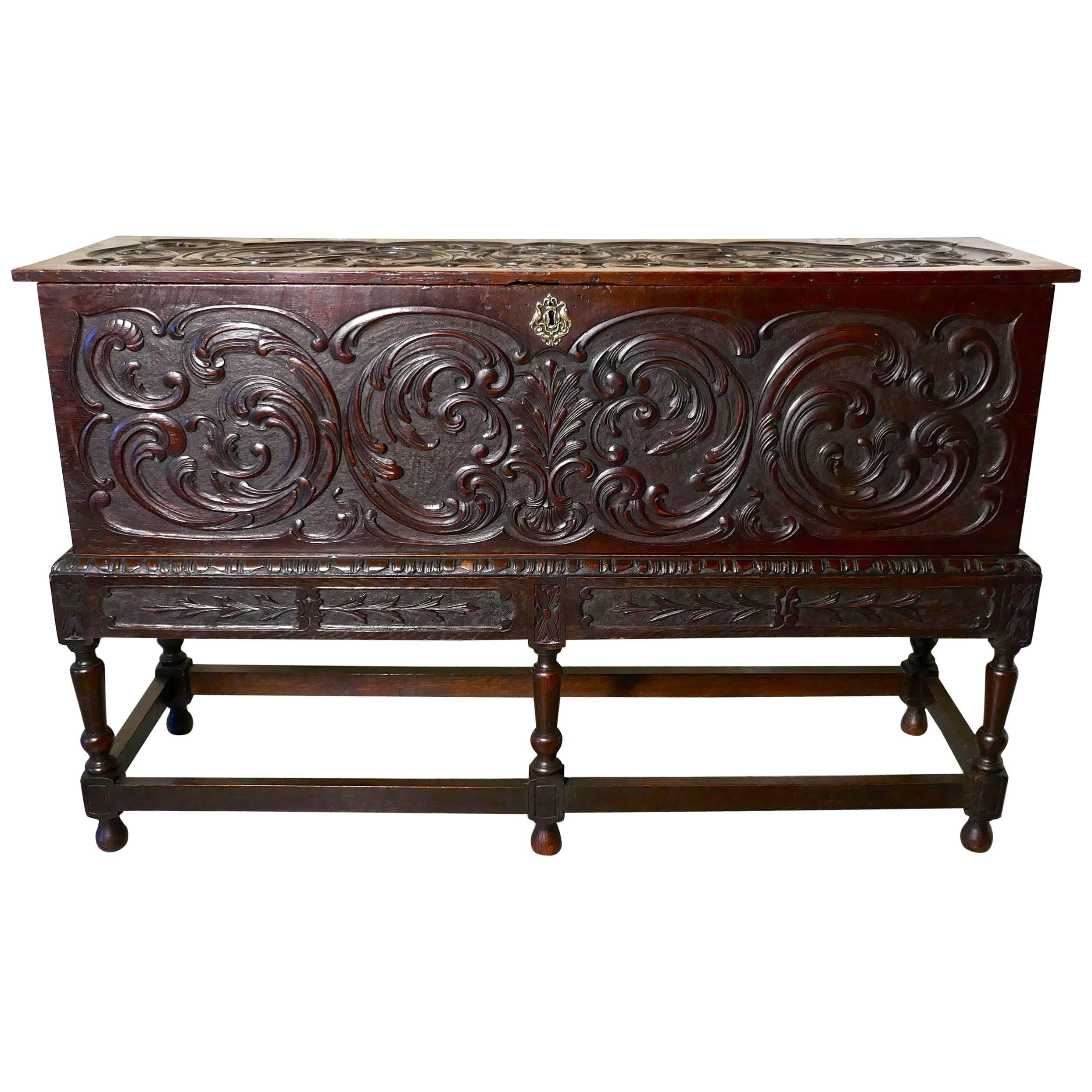 17th century carved oak sword chest on stand.

This is a rare and wonderful old piece, the chest is carved on the top sides and front
The quality of the carving is very fine, it is deep and crisp and in very good condition, the turned leg stand