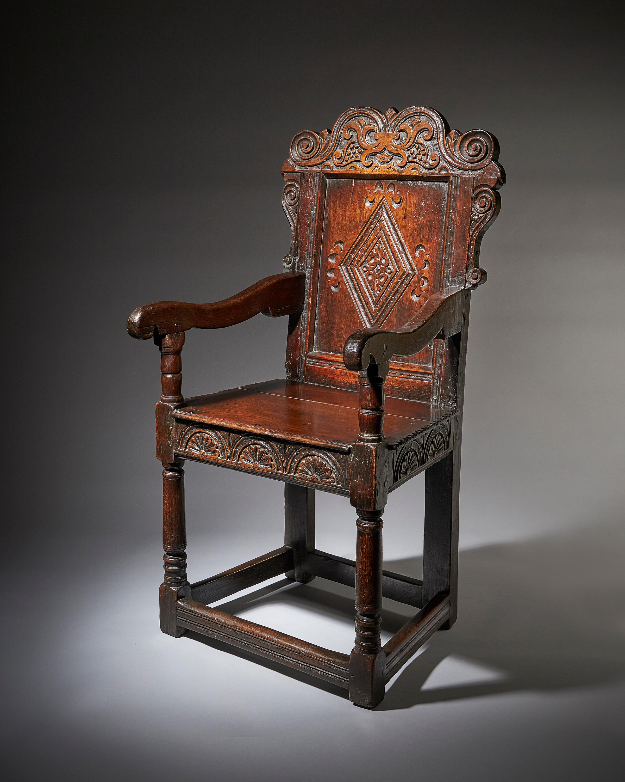 A superb and original carved Wainscot armchair, circa 1660. Yorkshire

This superb Wainscot chair dates from the middle of the 17th century and is most likely from the Leeds area of Yorkshire, with a large lozenge designed panel to the back and