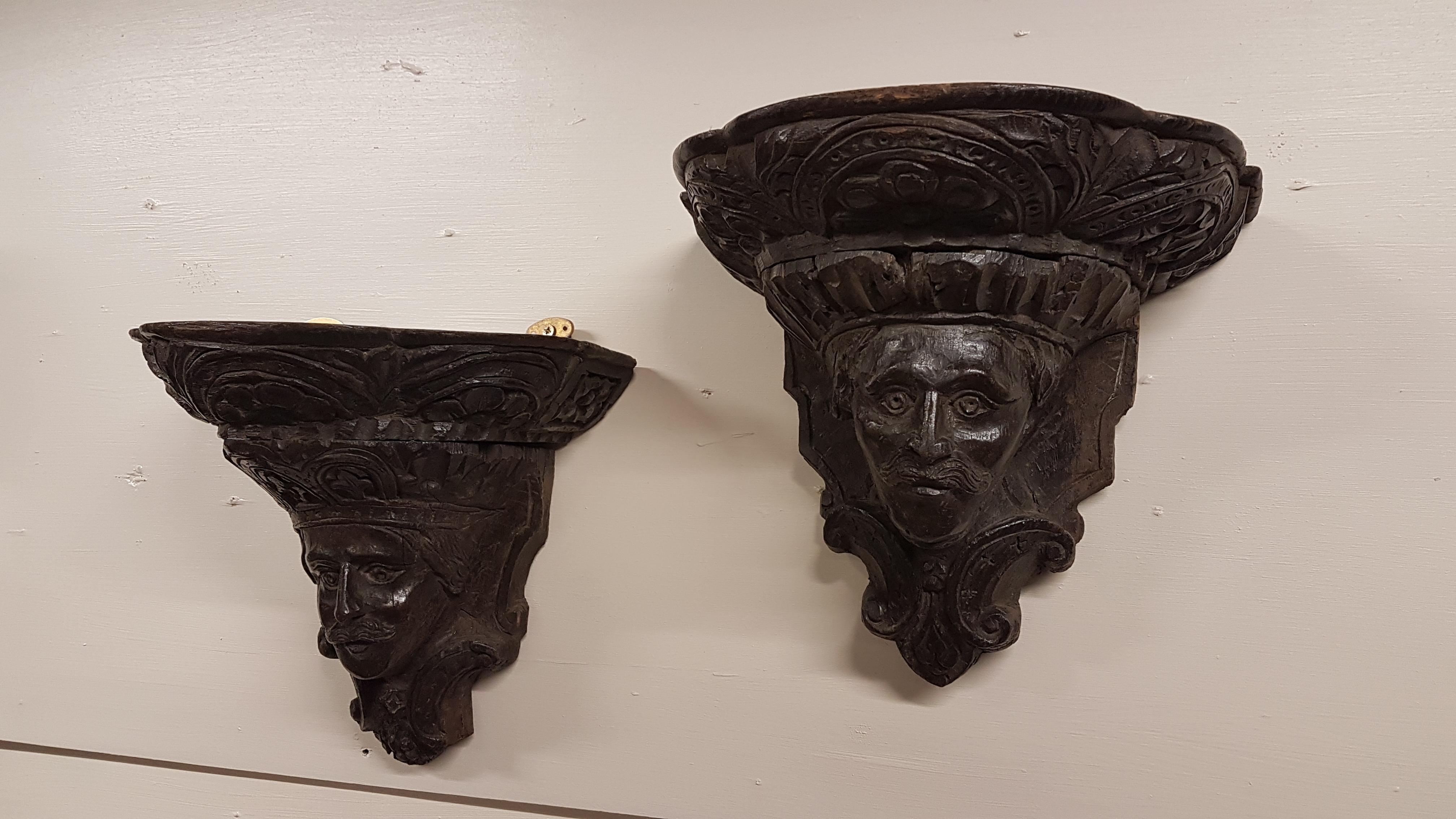 A superb pair of 17th century and later carved oak wall brackets with original wall mounting iron pegs in the top. They appear to depict Charles 1st on one and Archbishop William Laud. 
They are very well carved and have nice wear as you would
