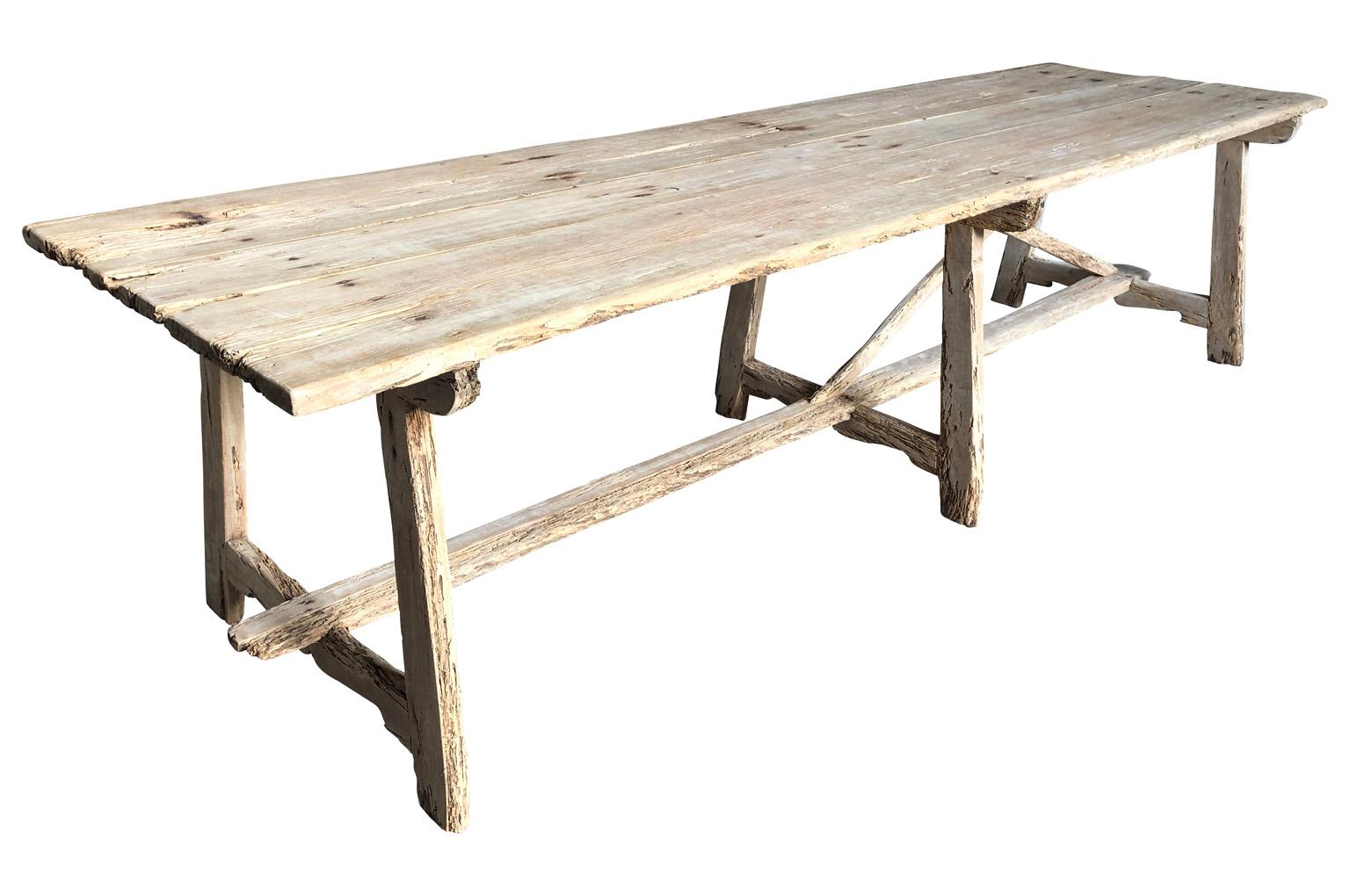An exceptional grand scale farm table - trestle table from the Catalan region of Spain. Beautifully constructed from apple wood with excellent patina. The table's Minimalist lines blend wonderfully with traditional or modern styling. A perfect table