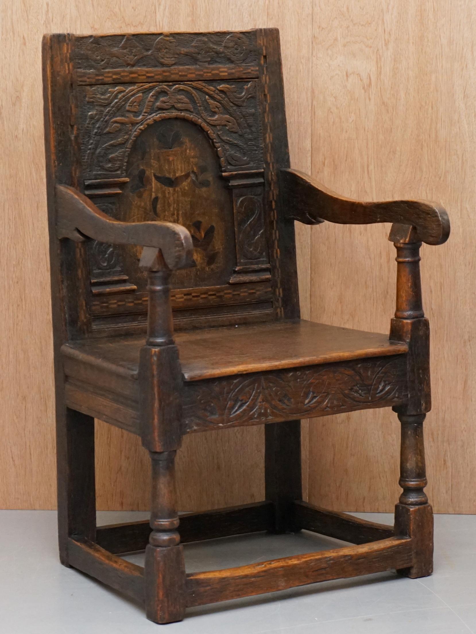 We are delighted to offer for sale this original early 17th century Charles I Wainscot armchair

A good early original piece, hand carved, very naïve but at the time this would have been considered very ornate. The chair has some kind of inlay