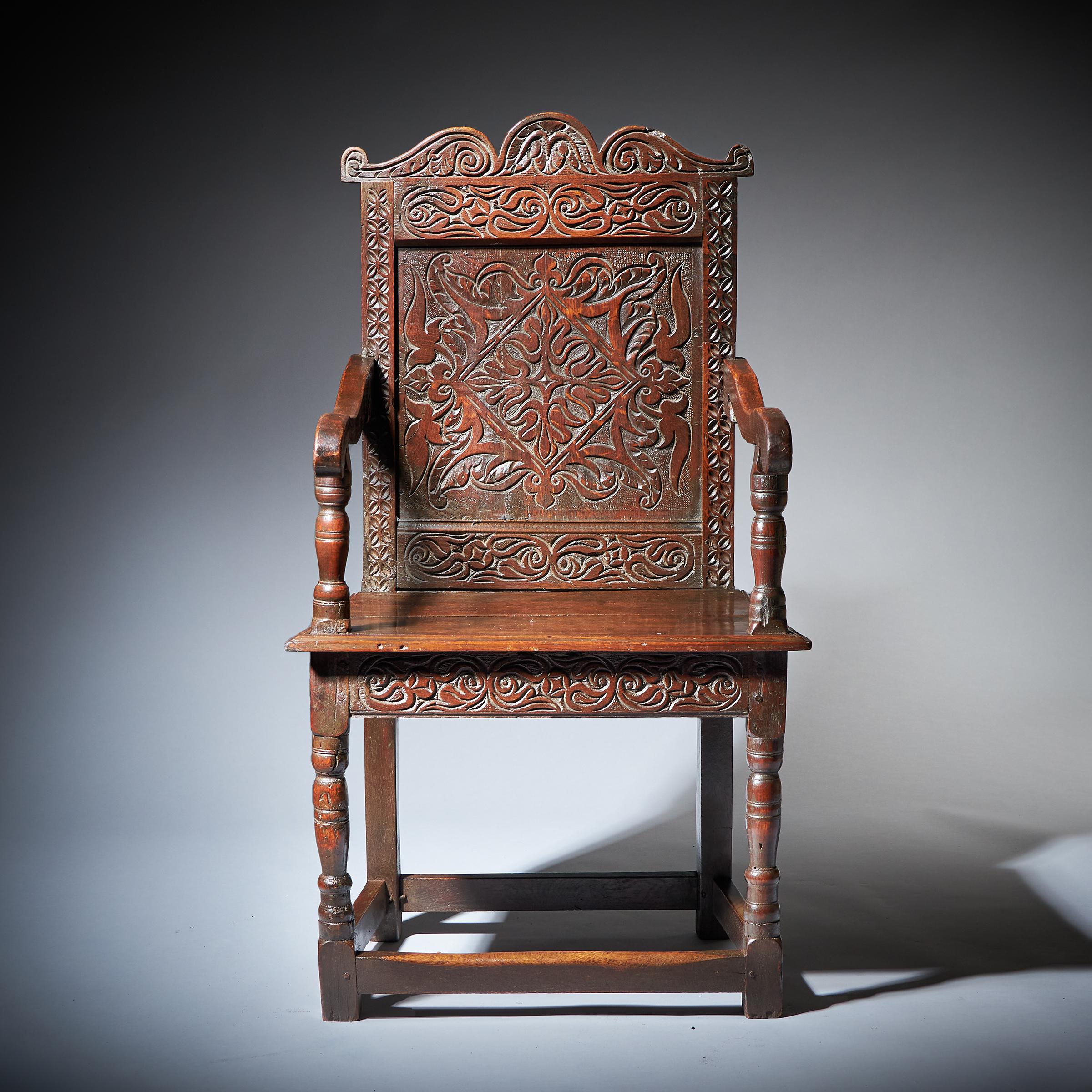 A superb and original carved Wainscot armchair, circa 1660. Yorkshire

This superb Wainscot chair dates from the middle of the 17th century and is most likely from the Leeds area of Yorkshire, with a large lozenge-designed panel to the back and