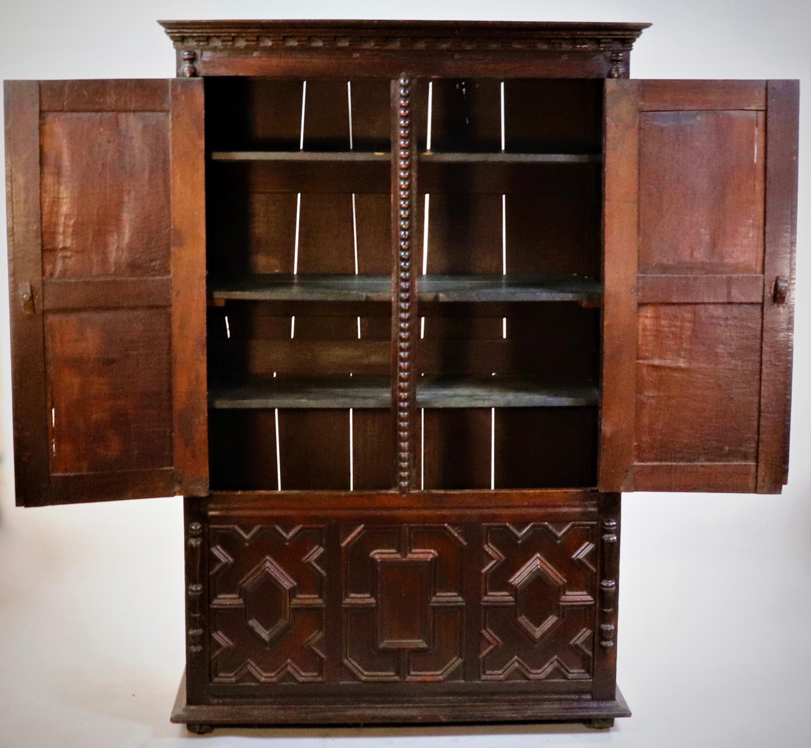 This is a circa 1660 Charles II English cupboard. This style was characterized by elaborate carvings and large frames. During Charles II's reign, there was a revival in the art and design of furniture-making, despite the challenges that arose from
