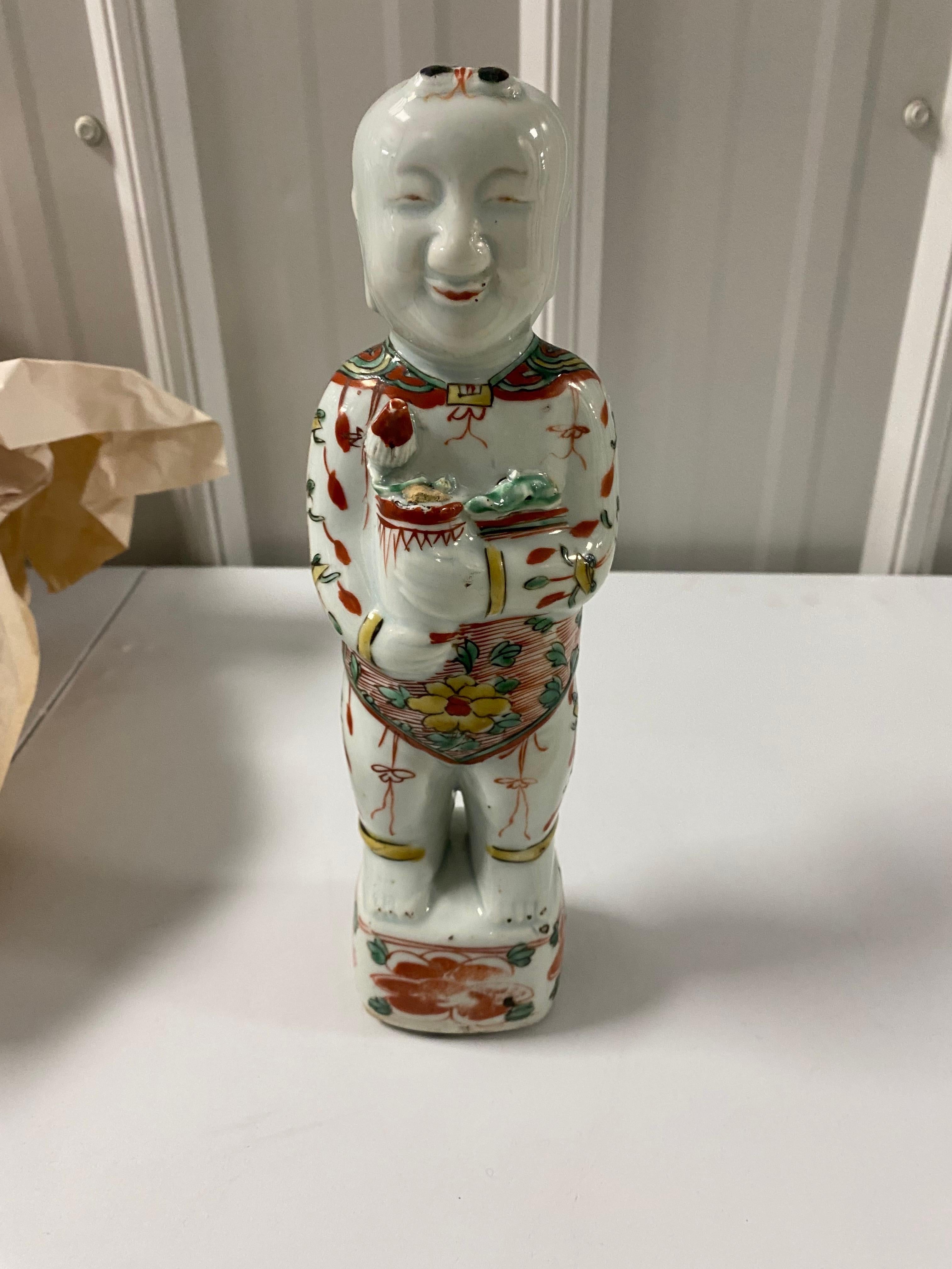 17th Century Chinese Porcelain Ho Ho Boy Figure in Wucai/Famille Vert Glaze.
Good overall condition. Screw inserted to hole on reverse to hang on wall.
Cannot tell if the front has an area of loss near the hand or it's if part of the design. Please