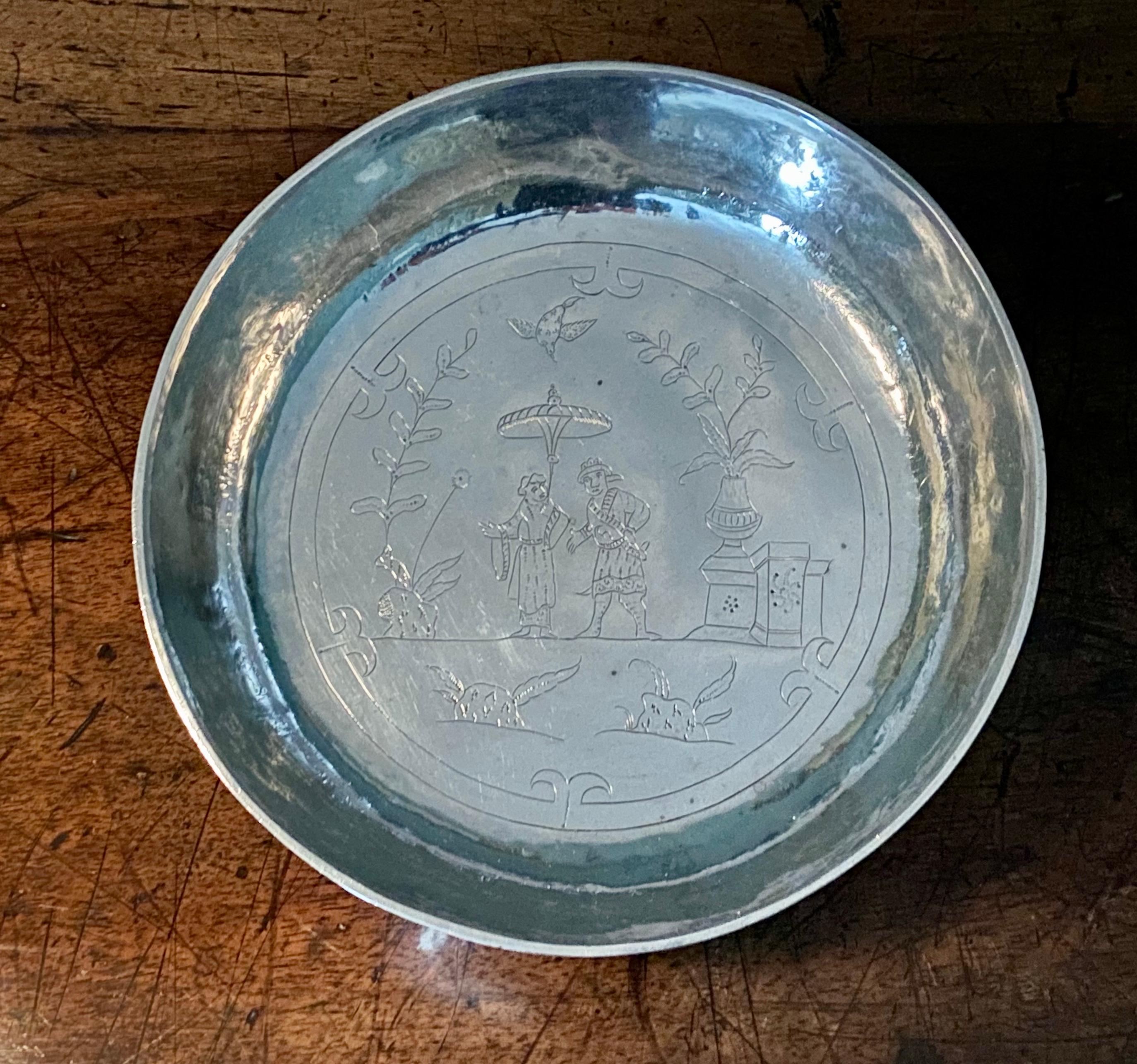 Rare Charles II chinoiserie silver bowl, flat-chased with figures and birds within gardens.