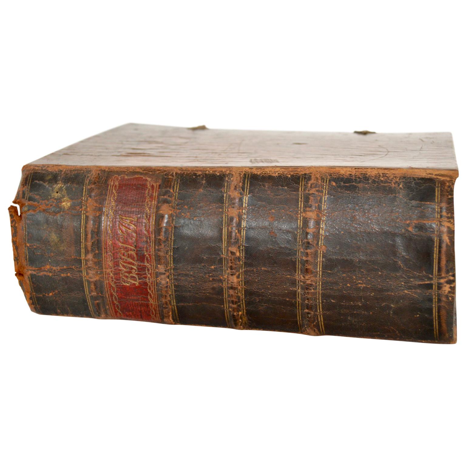 Danish leather back Bible with brass brackets. Editors Huus and Reyse in 1699.