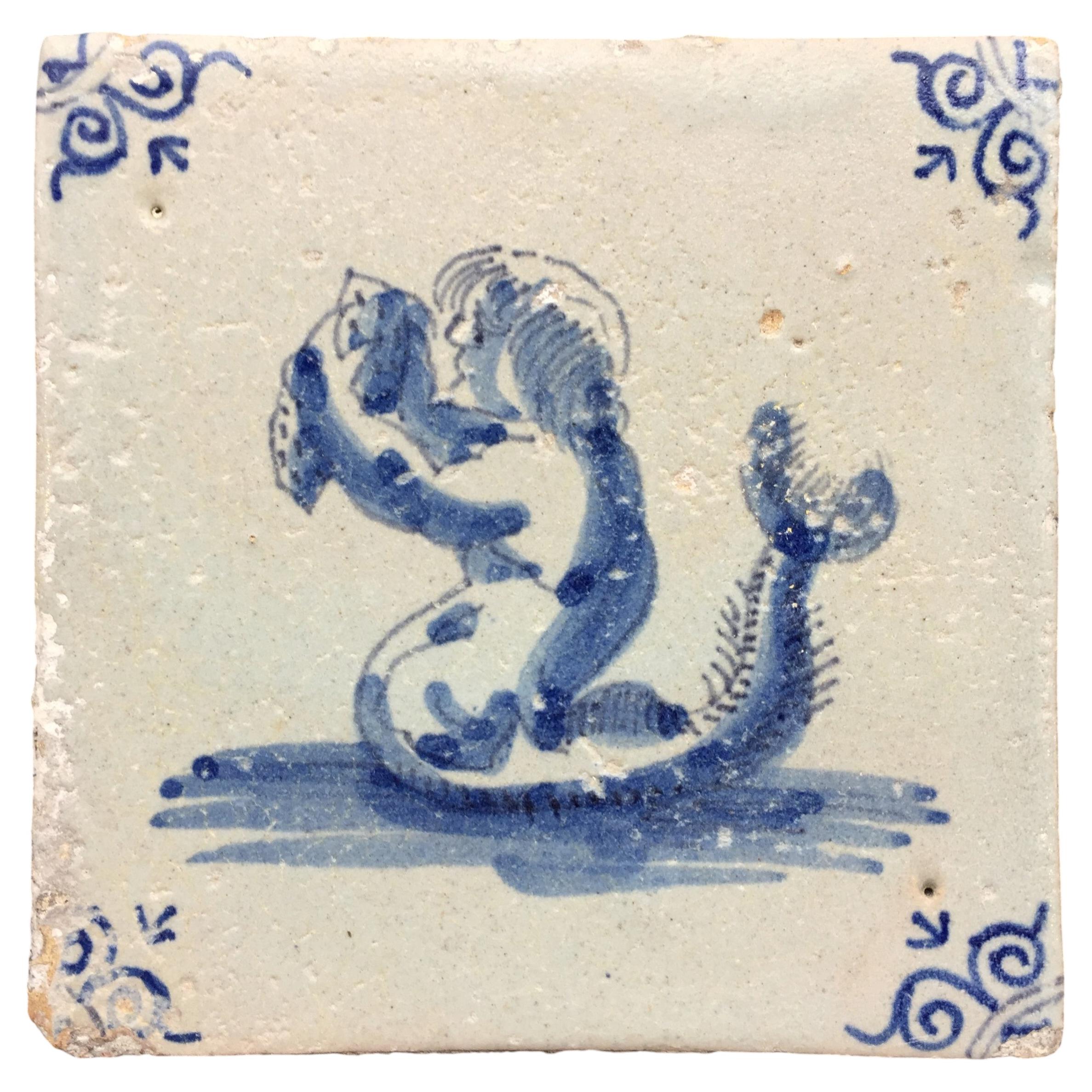Mattonella con creatura marina di Delft del XVII secolo con decorazione di un sireno