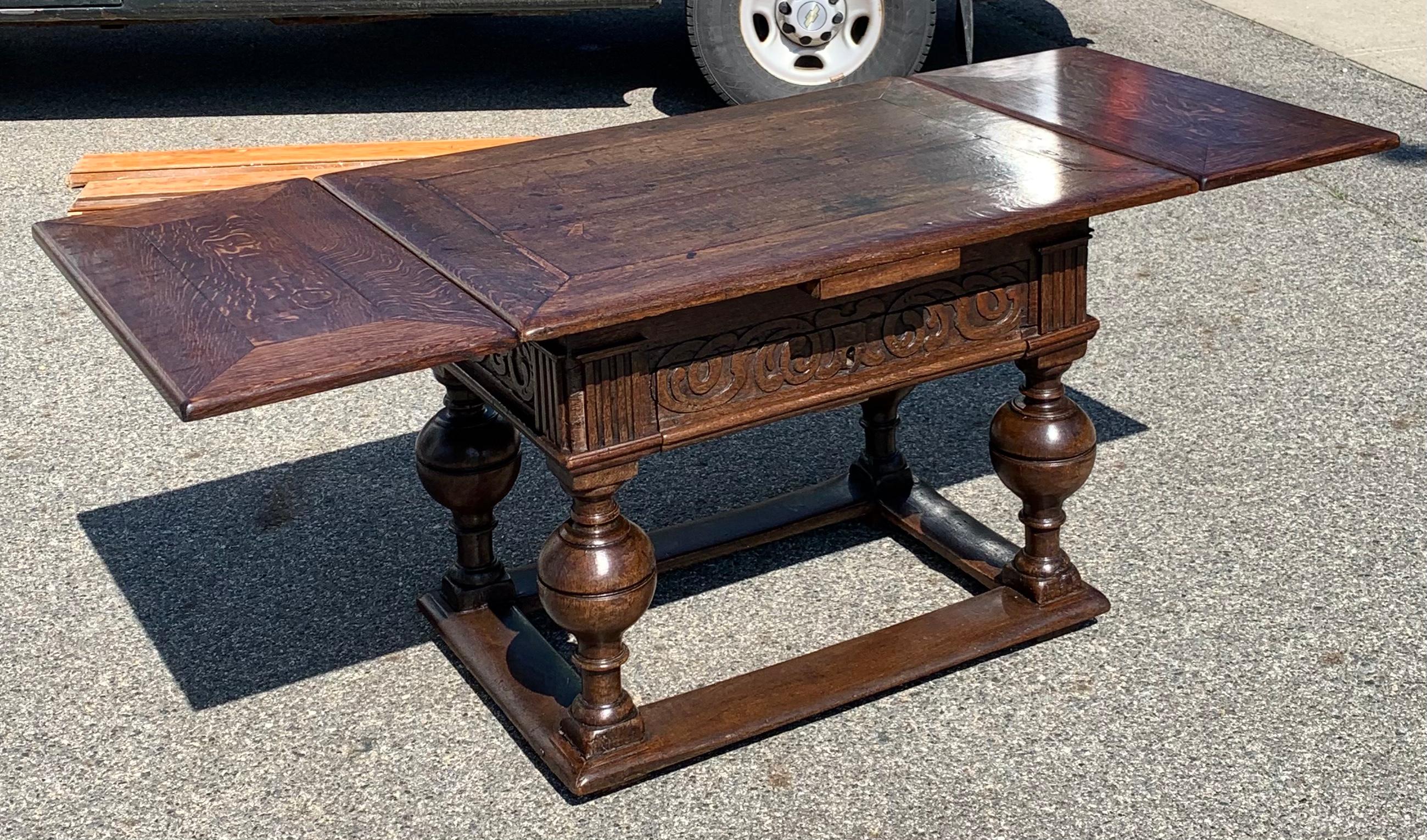 Period 17th century Dutch Jacobean Withdraw table with two pull out leaves. Oak with great patina and use. Carved Jacobean details and pull out drawer

Dimensions: 42.5