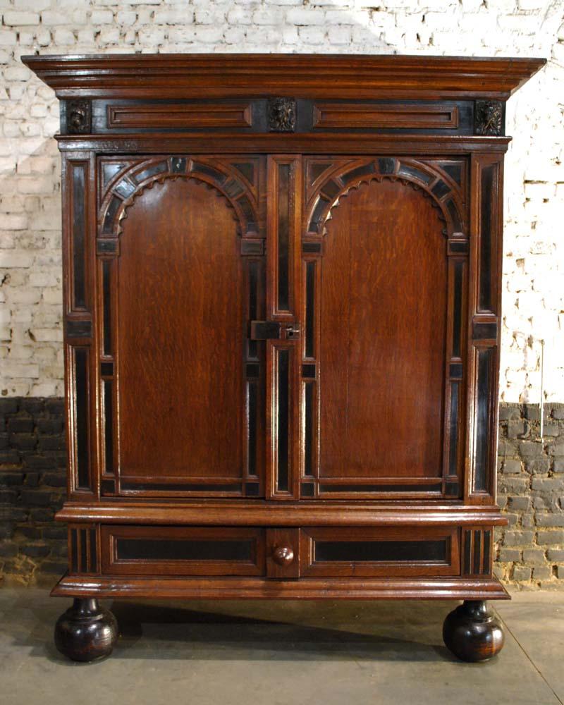 This extraordinary cupboard is made of the finest oak in the tradition of the Dutch Renaissance during the “Dutch golden age” 
It is a two-door cabinet with a drawer at the bottom. This cabinet is made in the Provence of Utrecht around 1650. The