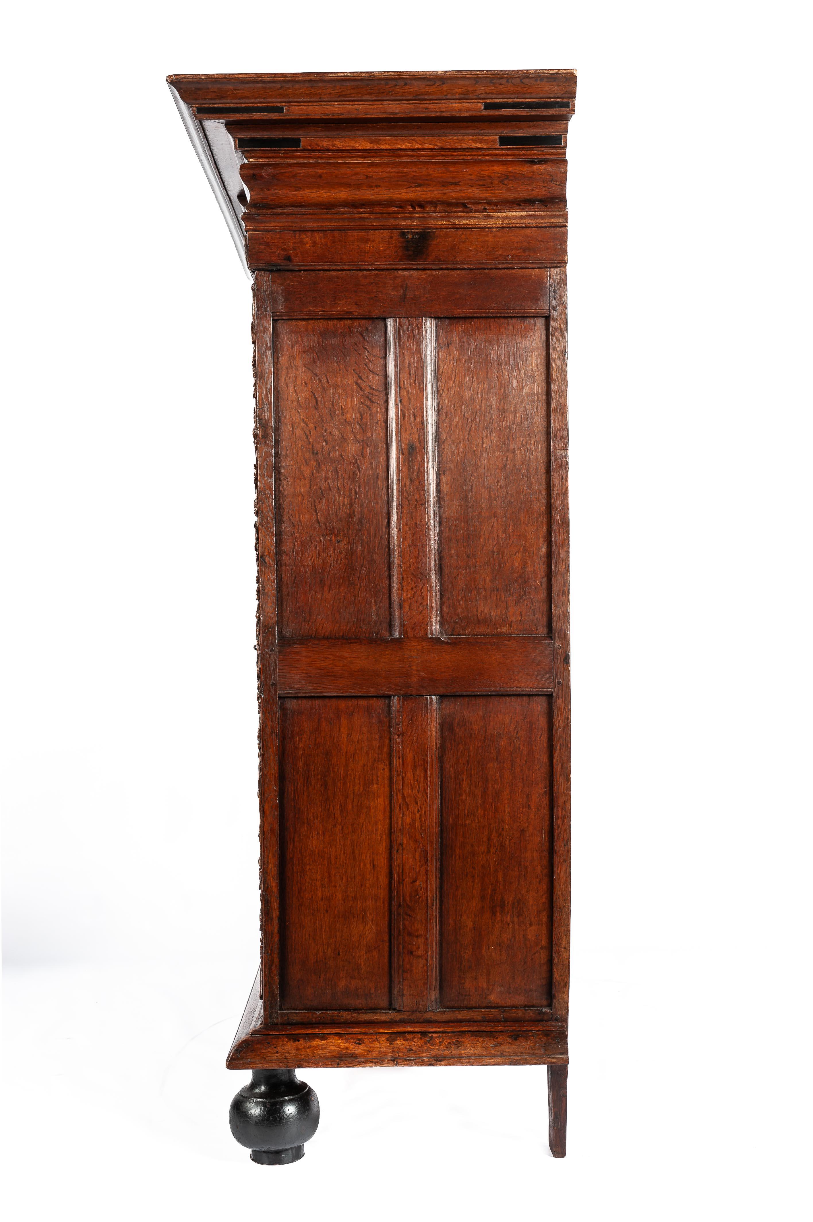 Carved +17th century Dutch renaissance two door portal cabinet with exotic carvings For Sale