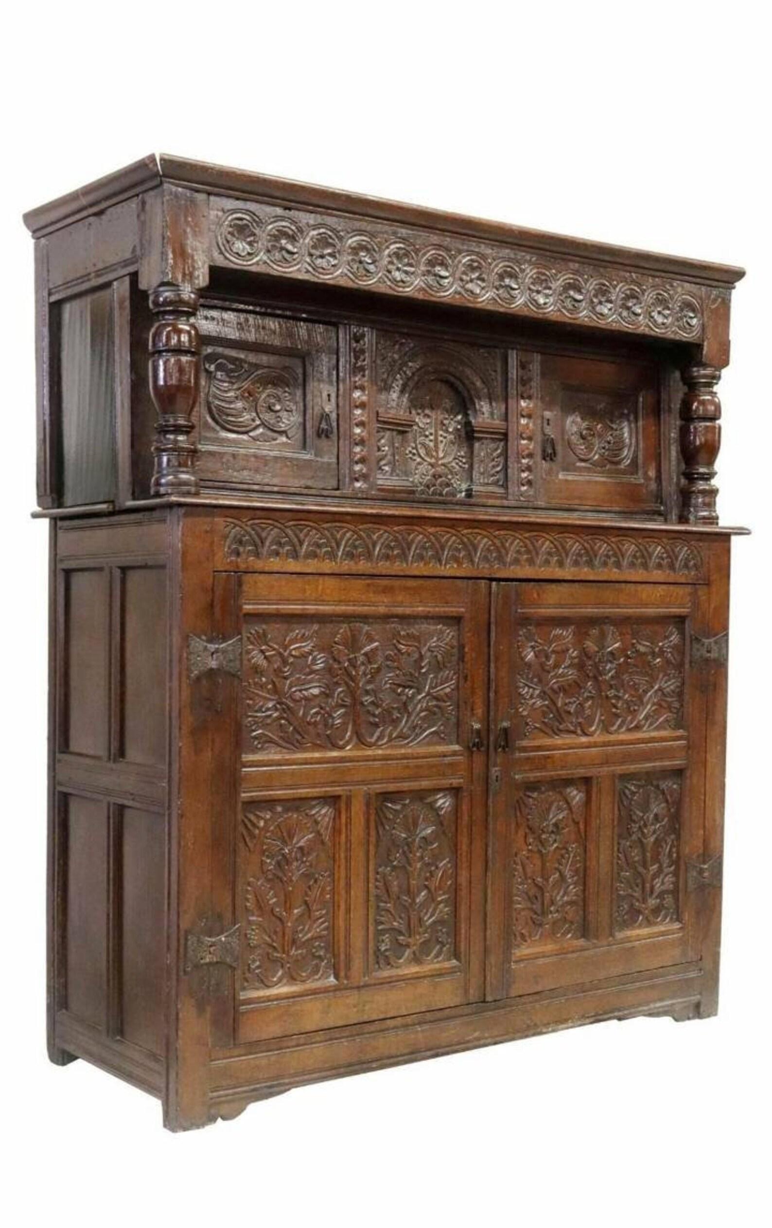 A most impressive antique, circa 1660-1700, English carved oak court cupboard (sideboard) with outstanding dark rich patina.

Born in England, most likely North County, dating to the late 17th century - possibly very early 18th century,
