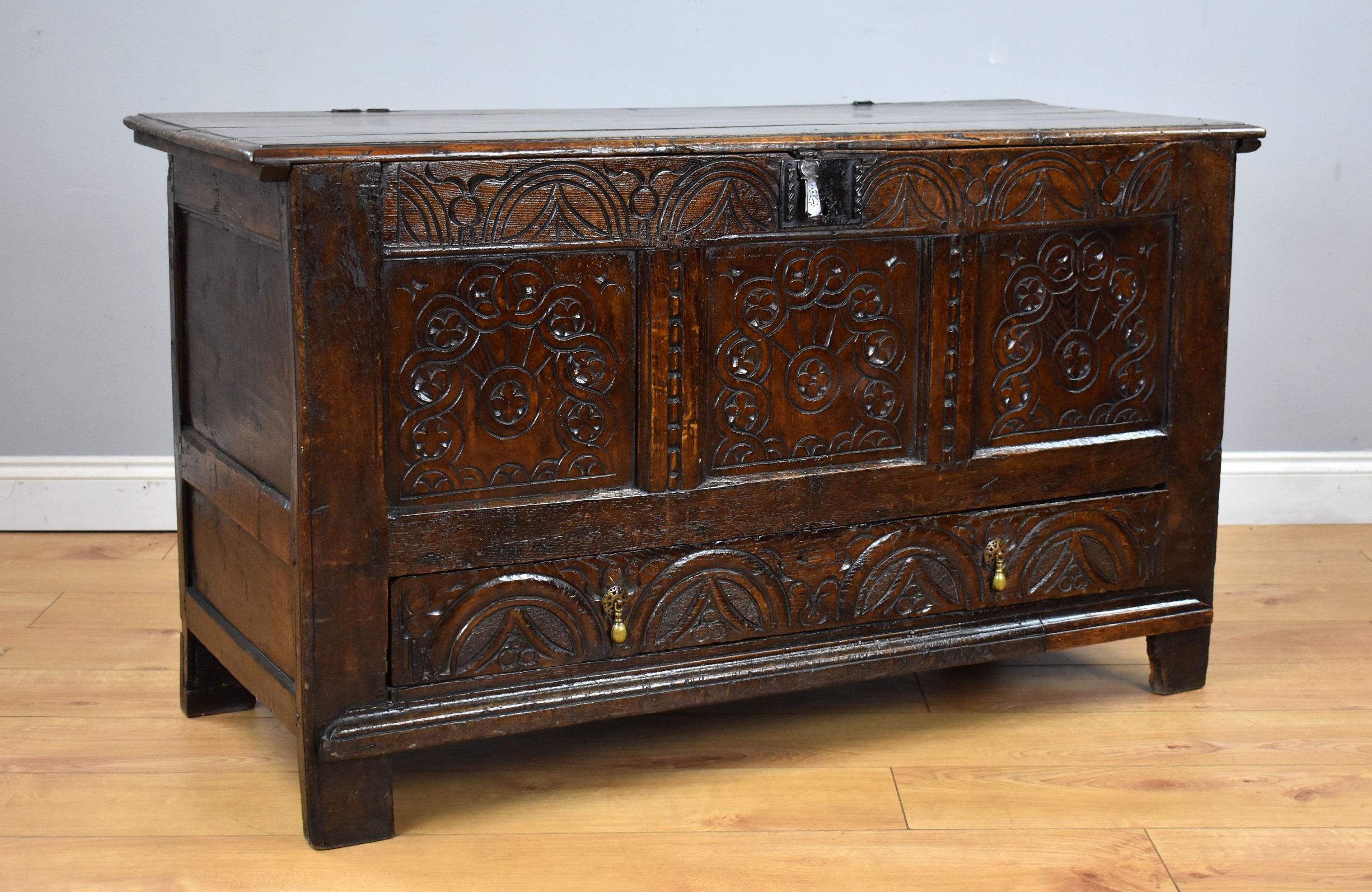 17th century English Charles II carved oak coffer in good original condition with nice carved front and drawer to the base. With original lock and hinges.