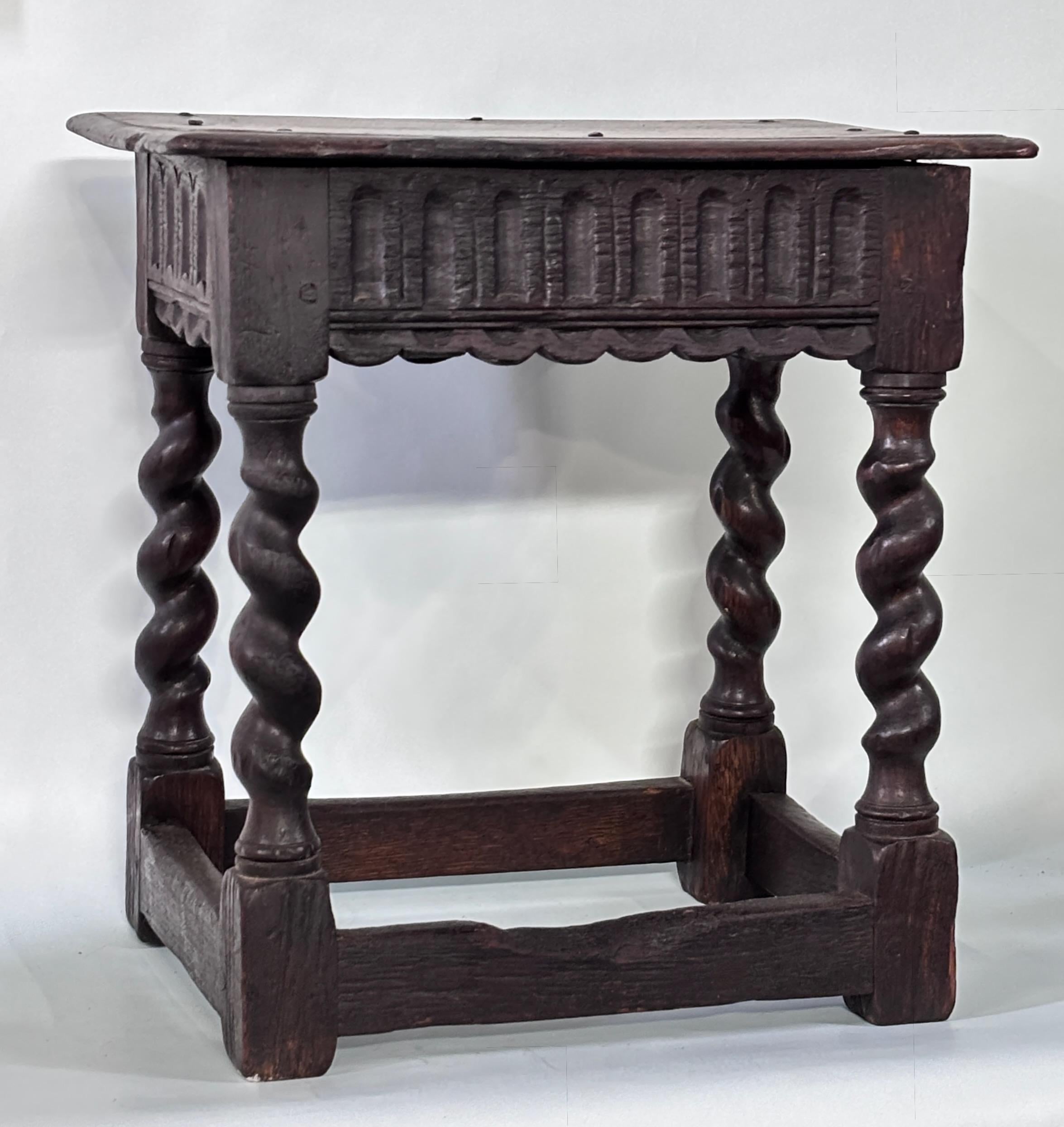 17th century English joint stool with turned legs and decorated apron.
Works as a stool or low side table next to a chair.
In very good antique condition with expected signs of use and age.

Overall, this joint stool is not only a functional piece