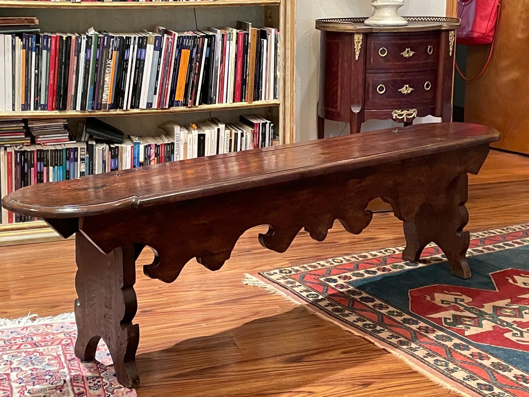 17th century English oak lift up top long trestle bench, circa 1700

This magnificent and impressive English trestle bench, made from heavy oak, stretches approximately 5 ½ feet long. The lift up top, with hand forged hinges, is made from two