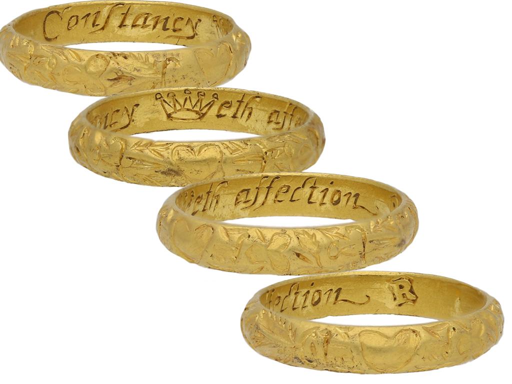 17th century engraved gold posy ring, 'Constancy weth affection.' A rare ring, the exterior of the D-shape band intricately engraved with hearts, tri-lobed floral sprigs and daggers, the interior inscribed with in italic script 'Constancy weth