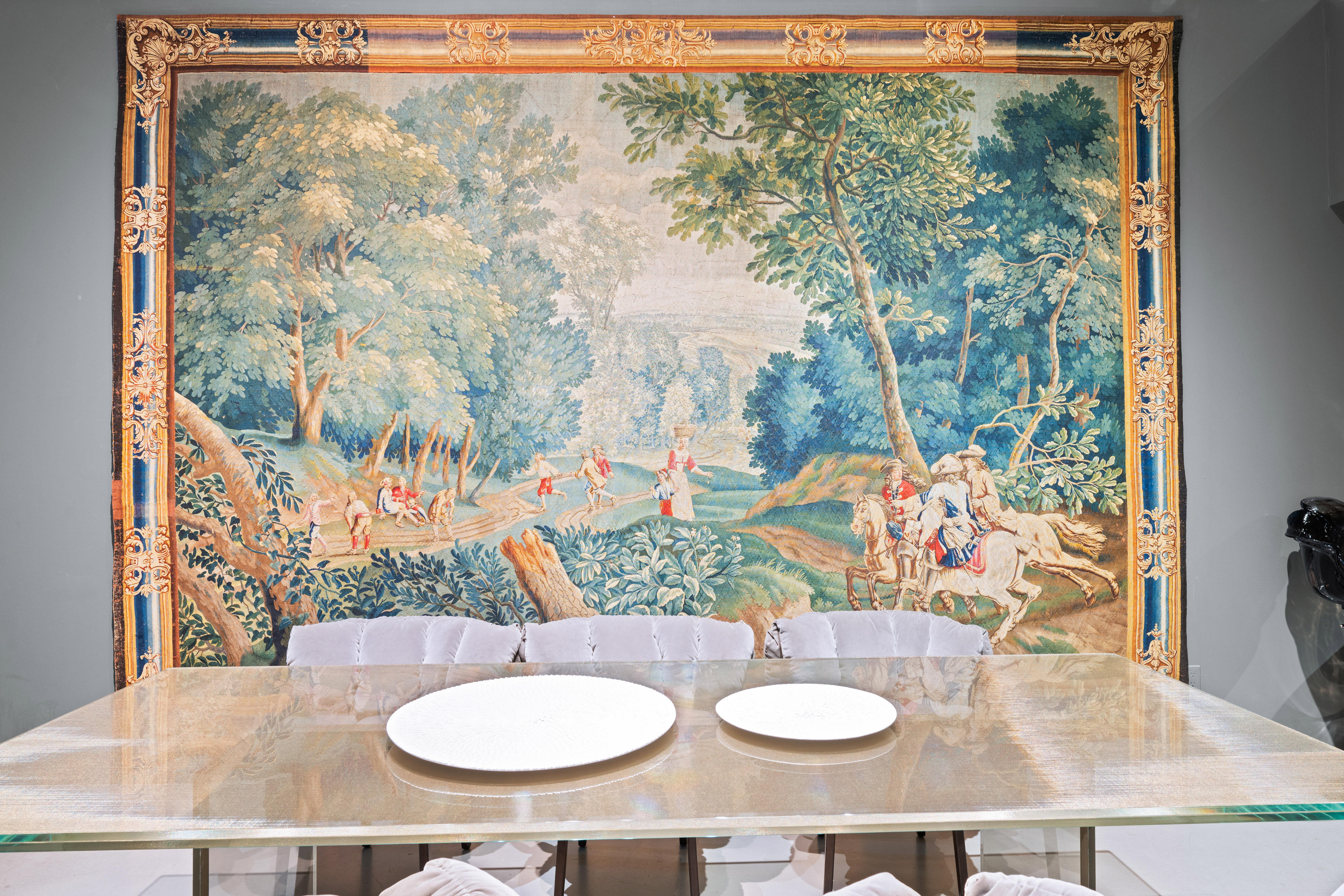 The tapestry shown here is a magnificent example of 17th-century European artistry, likely influenced by the grand tradition of tapestry weaving that flourished in France and Flanders during the Baroque period. Tapestries from this era were prized