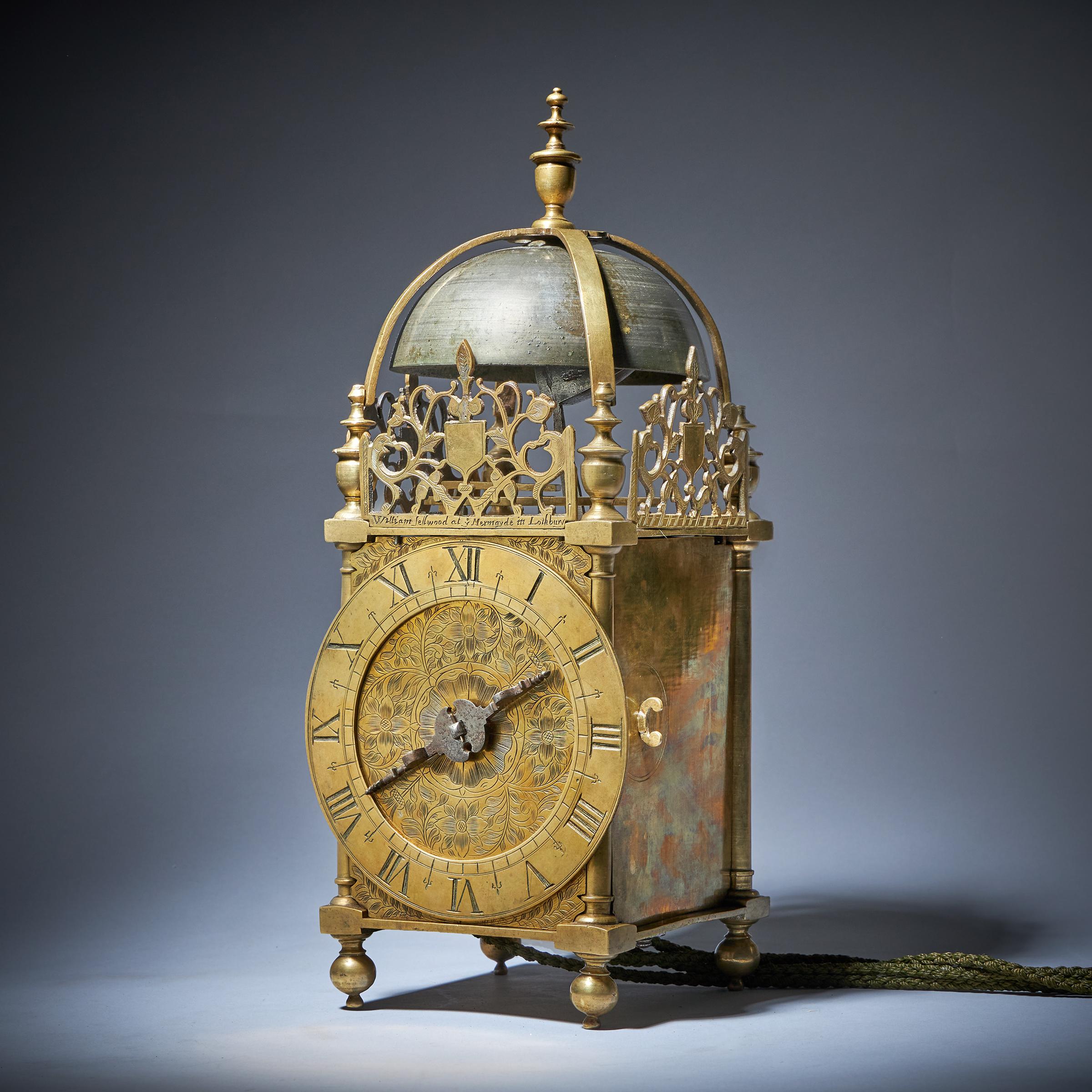 A magnificent and extremely rare first period English lantern clock, signed on the front fret William Sellwood at ye Mermayde in Lothbury, c.1635-40, with original balance.
 
This classic first-period lantern clock is in pristine condition