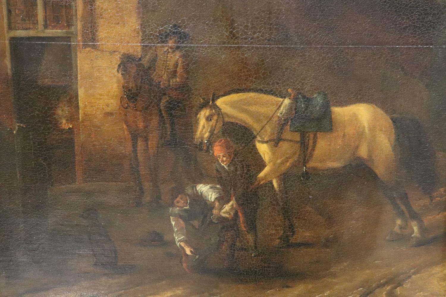 Beautiful antique oil painting on wood board. Excellent pictorial quality. Flemish school of the 17th century. A scene of everyday life in the village where in the foreground a farrier works on the horse's hooves. Not signed. Sold with rare antique