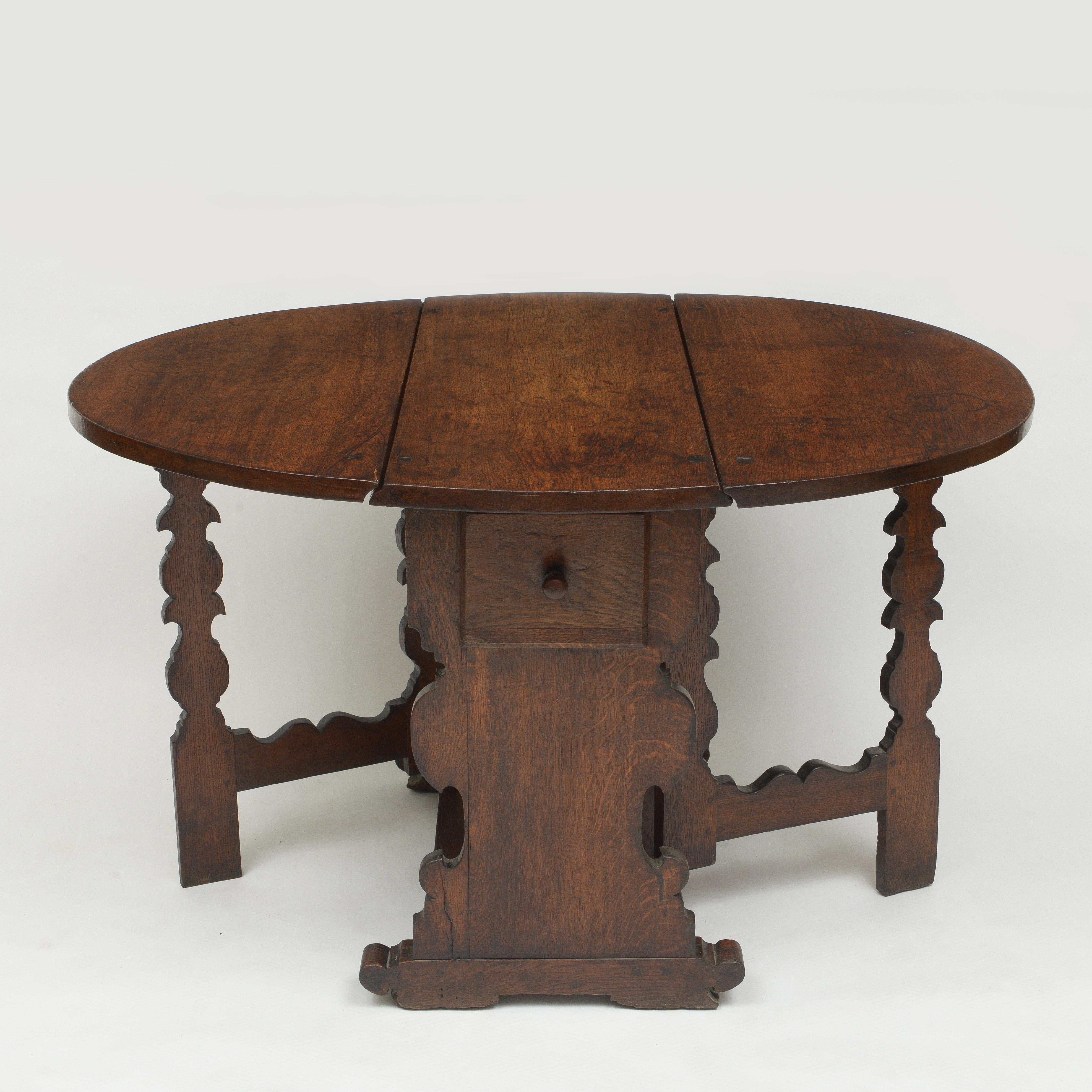 Early oval Oak table with carved gate legs and single drawer
Exceptional wax finish with great patina
All joints and hinges in good working order
Leaves down closed dimensions is 16 inches wide