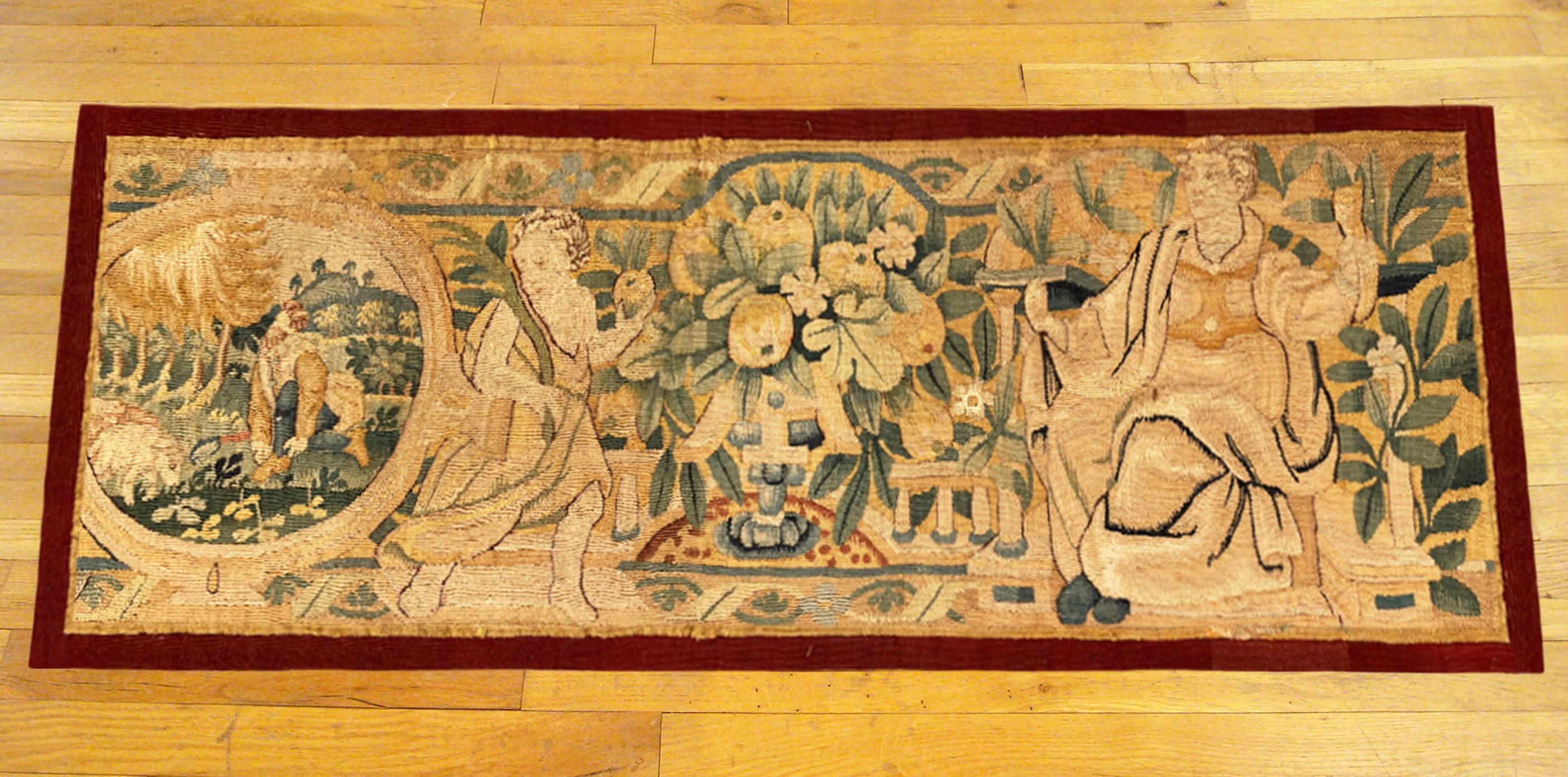 A 17th century Flemish Historical Tapestry panel. This horizontally oriented decorative tapestry panel depicts a regal female figure at right, with a mythological angelic figure at center, and an additional figure in a pendant cartouche at left. The