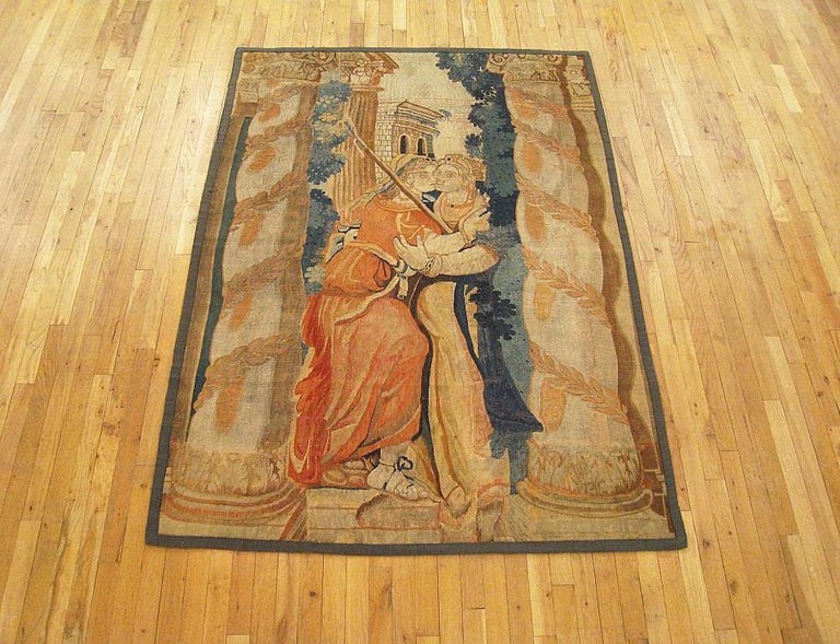 A Flemish historical tapestry from the first half of the 17th century, envisioning two women (possibly Octavia and Atia, sister and mother, respectively, of the ancient Roman leader, Octavian) embracing, flanked by spiraling columns. Enclosed within