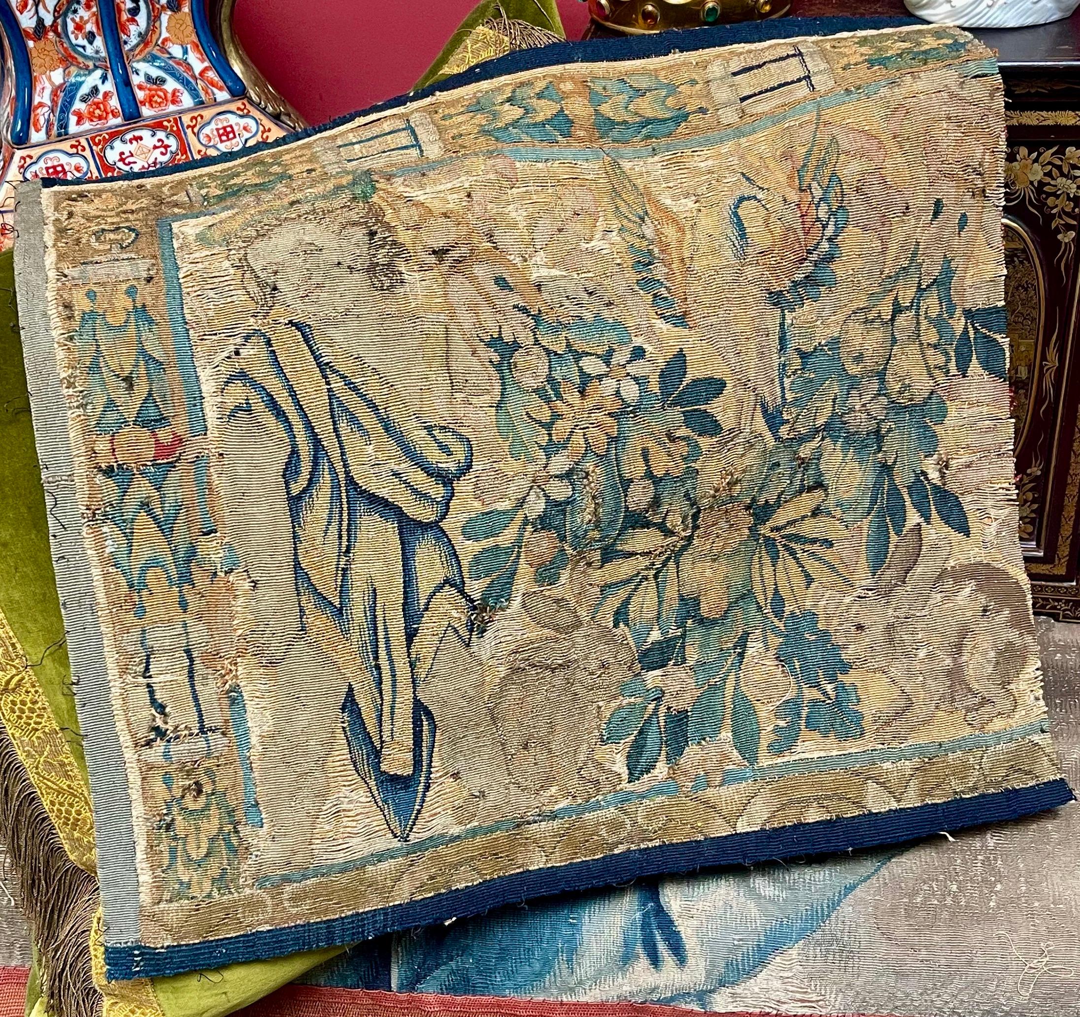 A Flemish Tapestry Panel
Dating from 17th century

Hand woven using naturally dyed wools and silks

Featuring a full length Cherub, a Phoenix and a pair of baby Rabbits

Antique condition with general signs of wear commensurate with immense age and