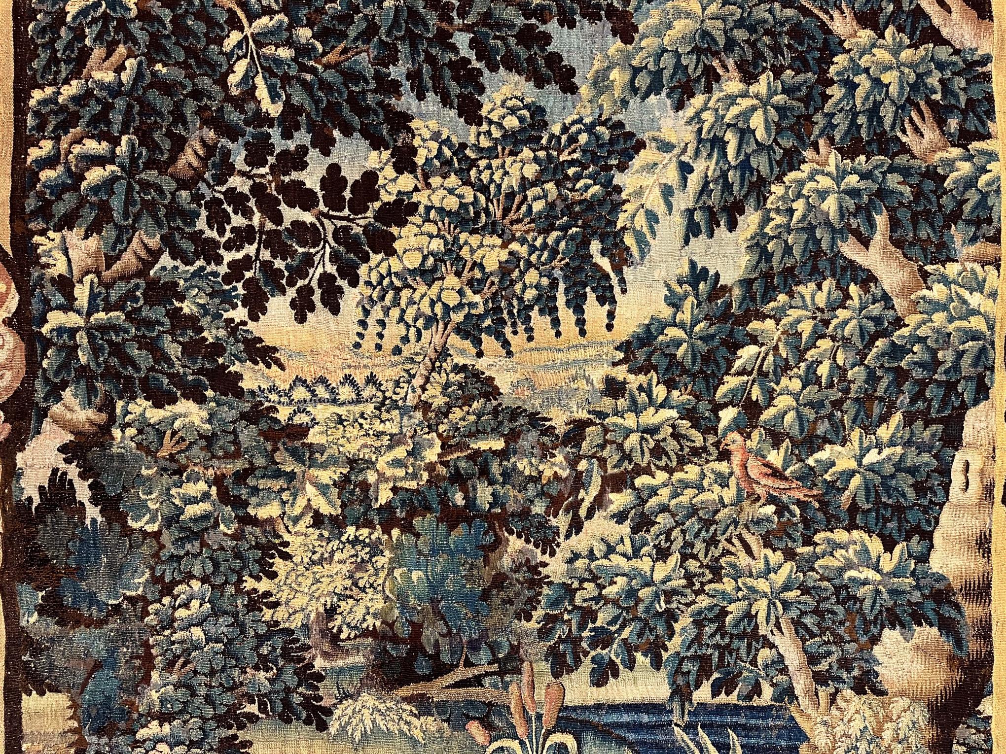 Wool 17th Century Flemish Verdure Landscape Tapestry, a Lush Forest & Pendant Border For Sale