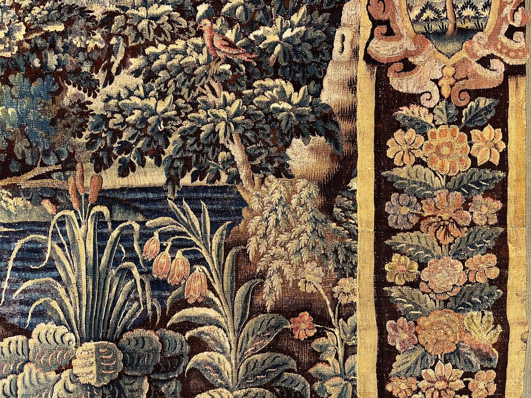 17th Century Flemish Verdure Landscape Tapestry, a Lush Forest & Pendant Border For Sale 1