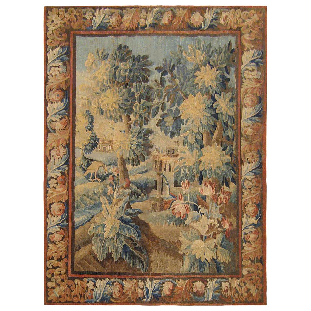 Tapisserie de paysage en verdure flamande du XVIIe siècle, avec arbres, buissons et fleurs