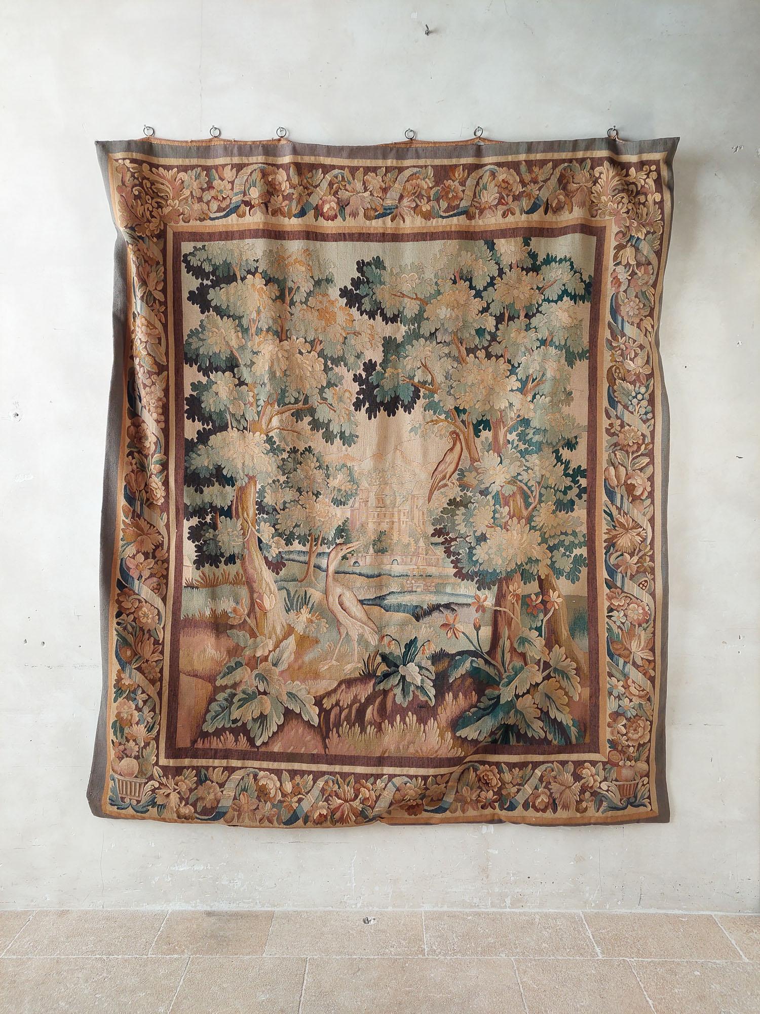 17th century verdure tapestry, Gobelin. Antique Flemish tapestry, with foliage in beautiful colors, the edge is original.

h 280 x w 220 cm