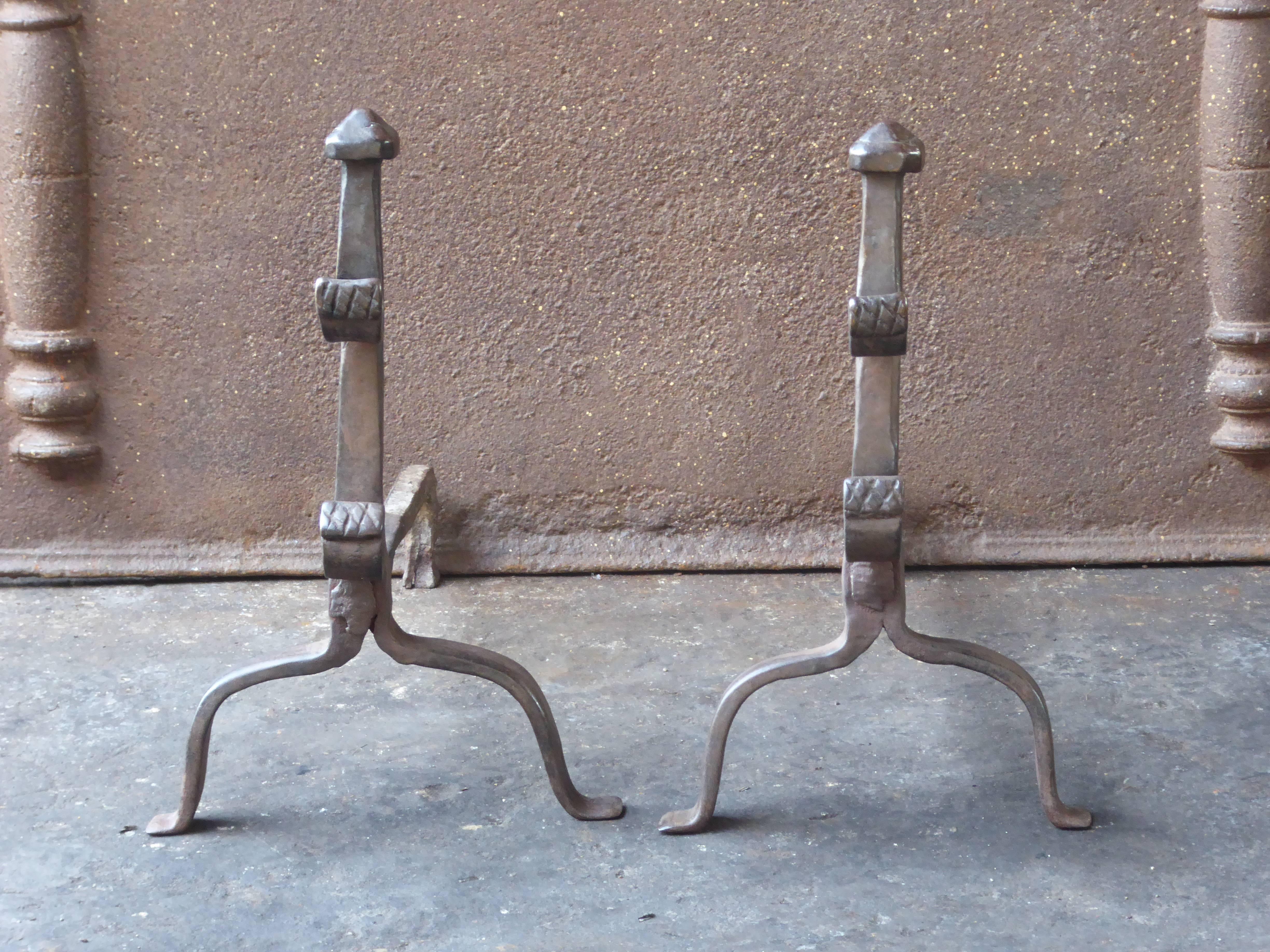 17th century French Gothic andirons made of wrought iron.

We have a unique and specialized collection of antique and used fireplace accessories consisting of more than 1000 listings at 1stdibs. Amongst others, we always have 300+ firebacks, 250+