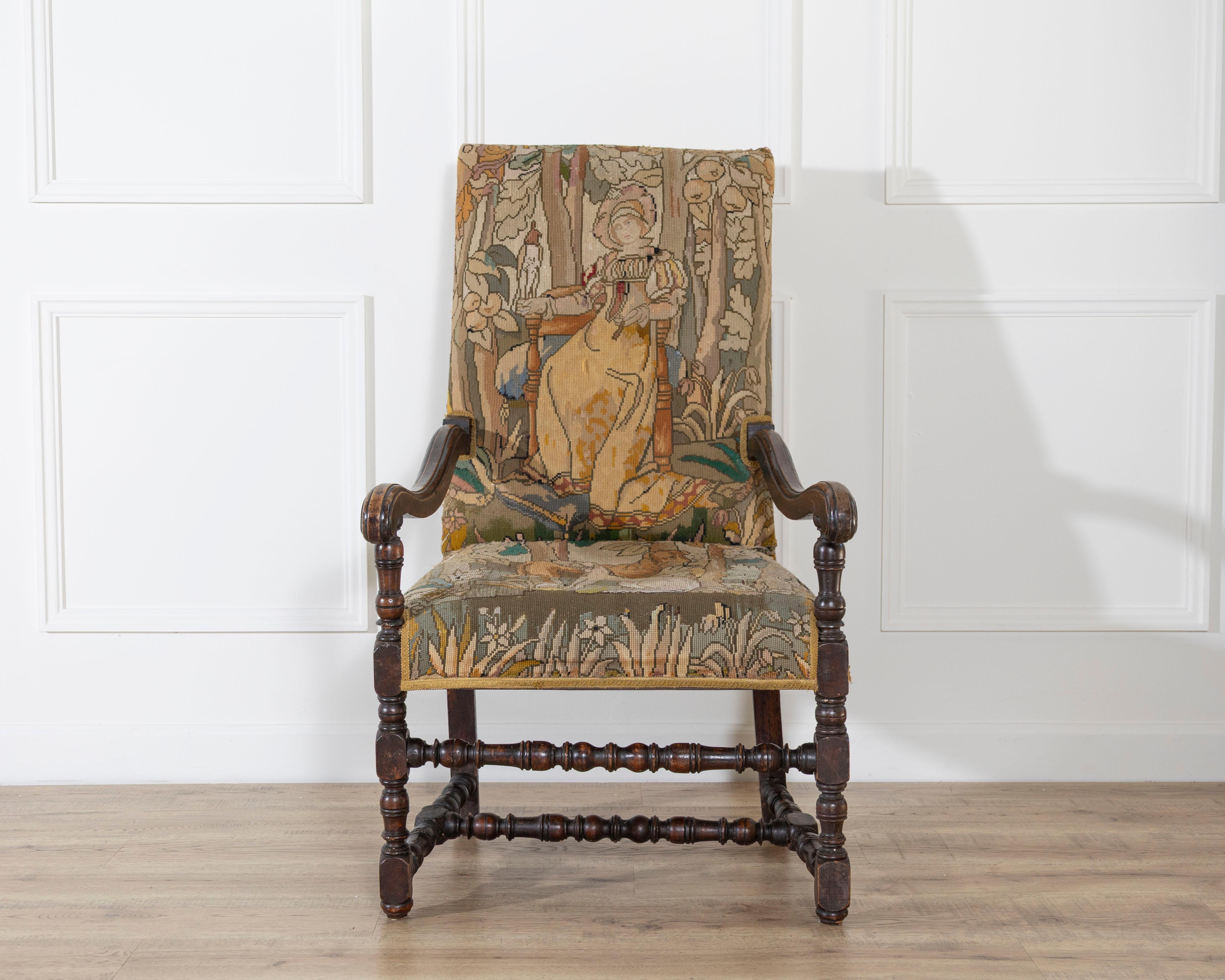 Französischer Barocksessel aus Nussbaumholz aus dem 17. Jahrhundert, der Zeit Ludwigs XIV. Das Gestell wird von gedrechselten, geklöppelten Pfosten und Streben bestimmt, die dem Stuhl seinen skulpturalen Rhythmus und seine starke architektonische